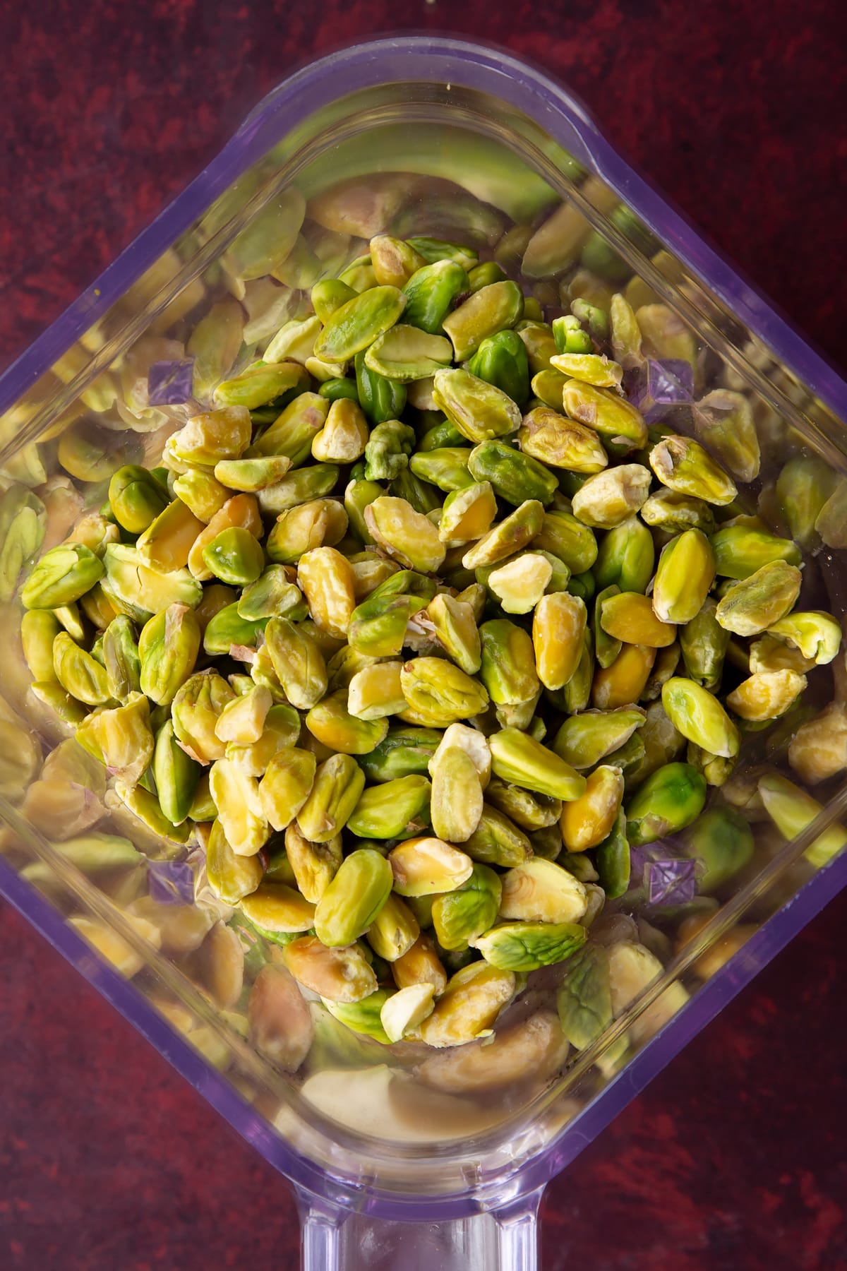 Overhead shot of the pistachios in a blender.