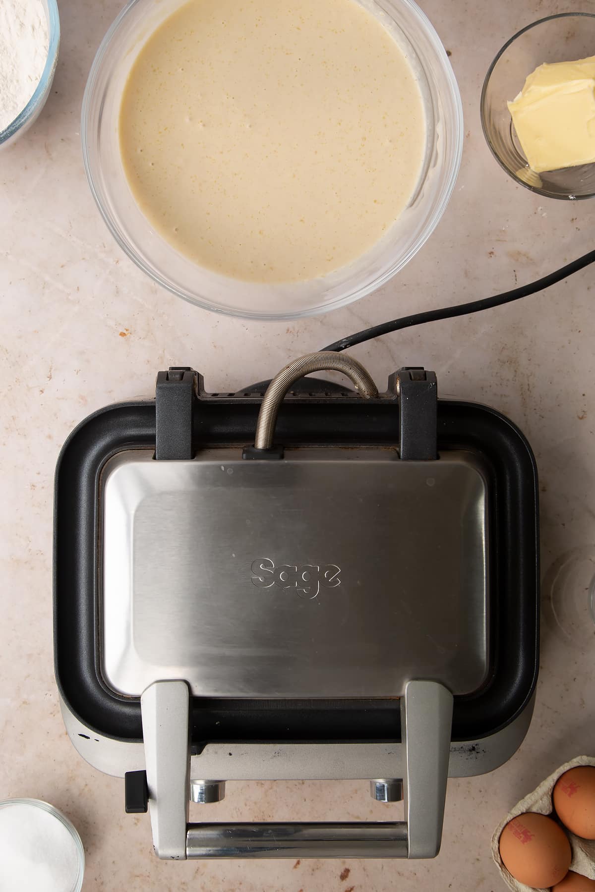 The sage smart waffle maker folded shut.