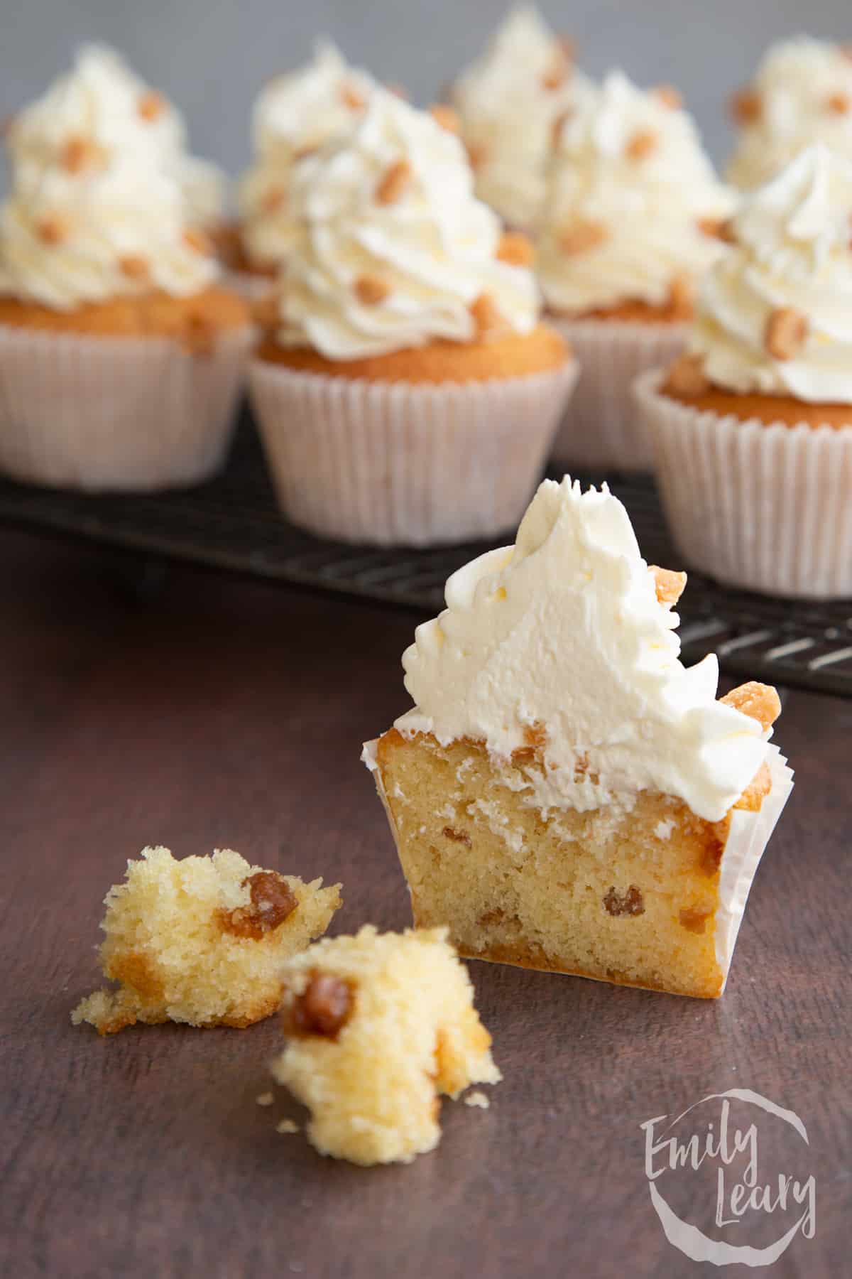 a vanilla fudge cupcake topped with vanilla buttercream and fudge pieces cut in half.