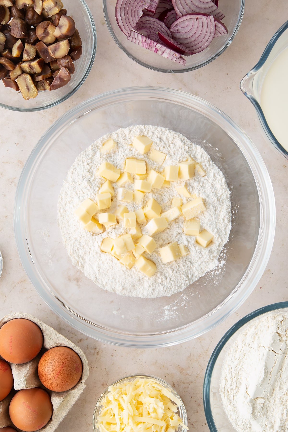 Overhead shot of butter and flour in a mixing bowl.