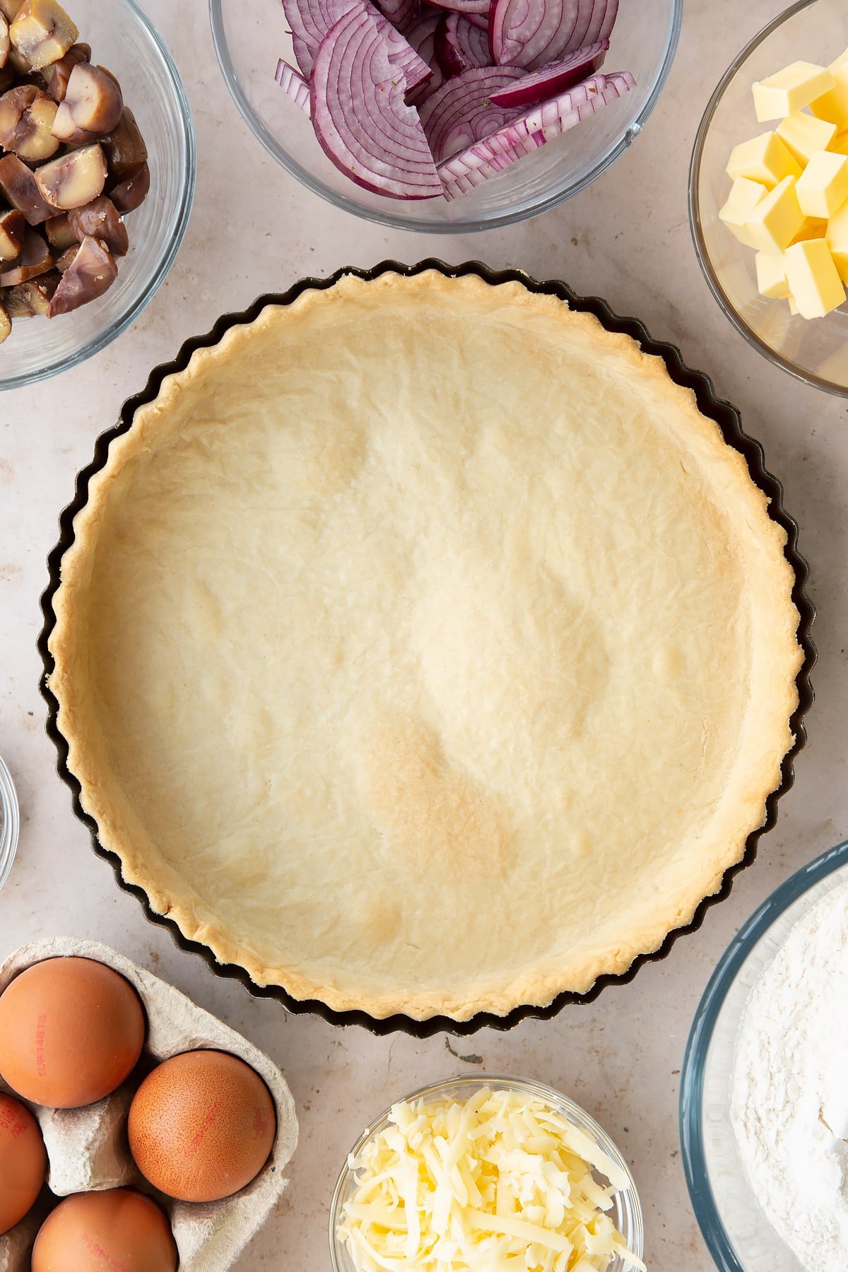 Overhead shot of the chestnut quiche pastry casing having been in the oven for a further 5 minutes (20 minutes in total)