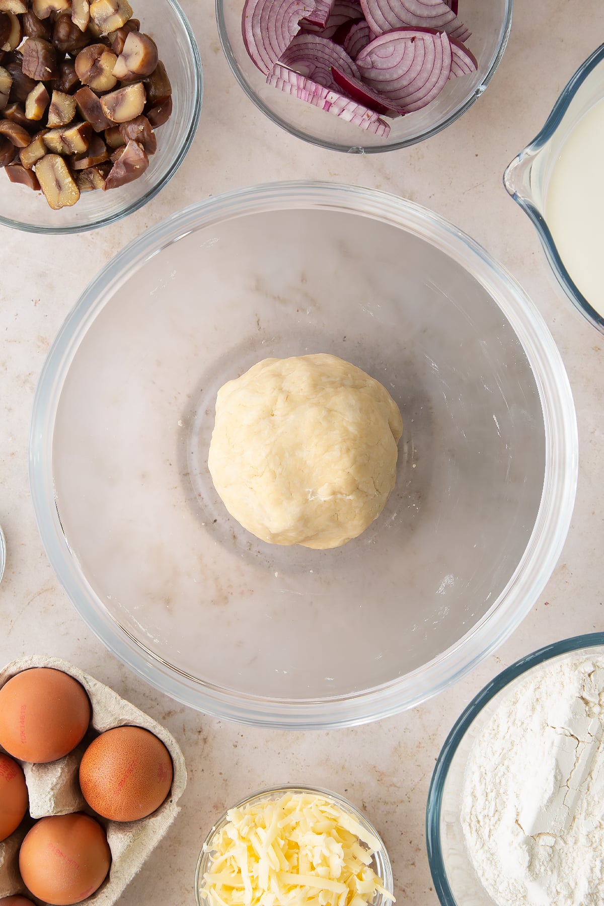 Overhead shot of the pastry mixture having been rolled into a ball.