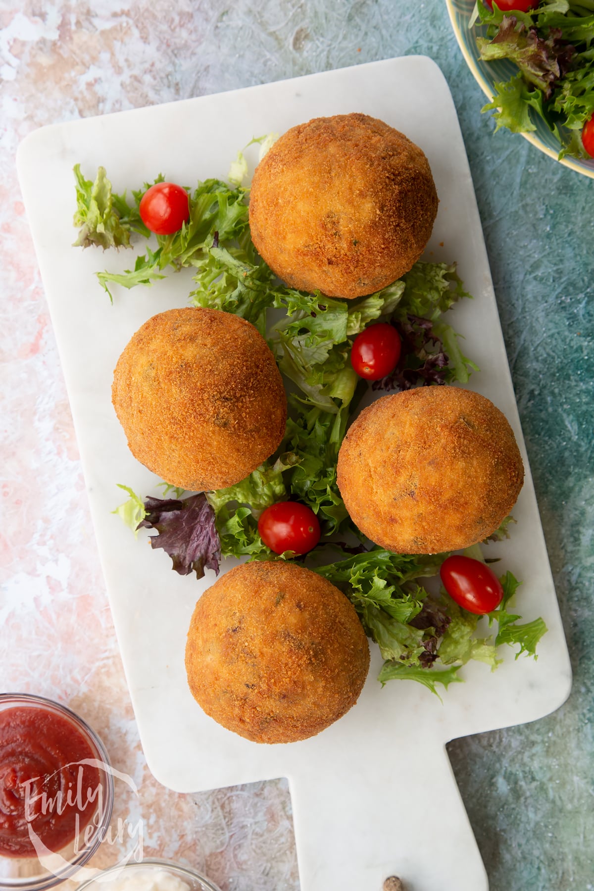 4 cooked vegetarian scotch eggs on a paper towel base.