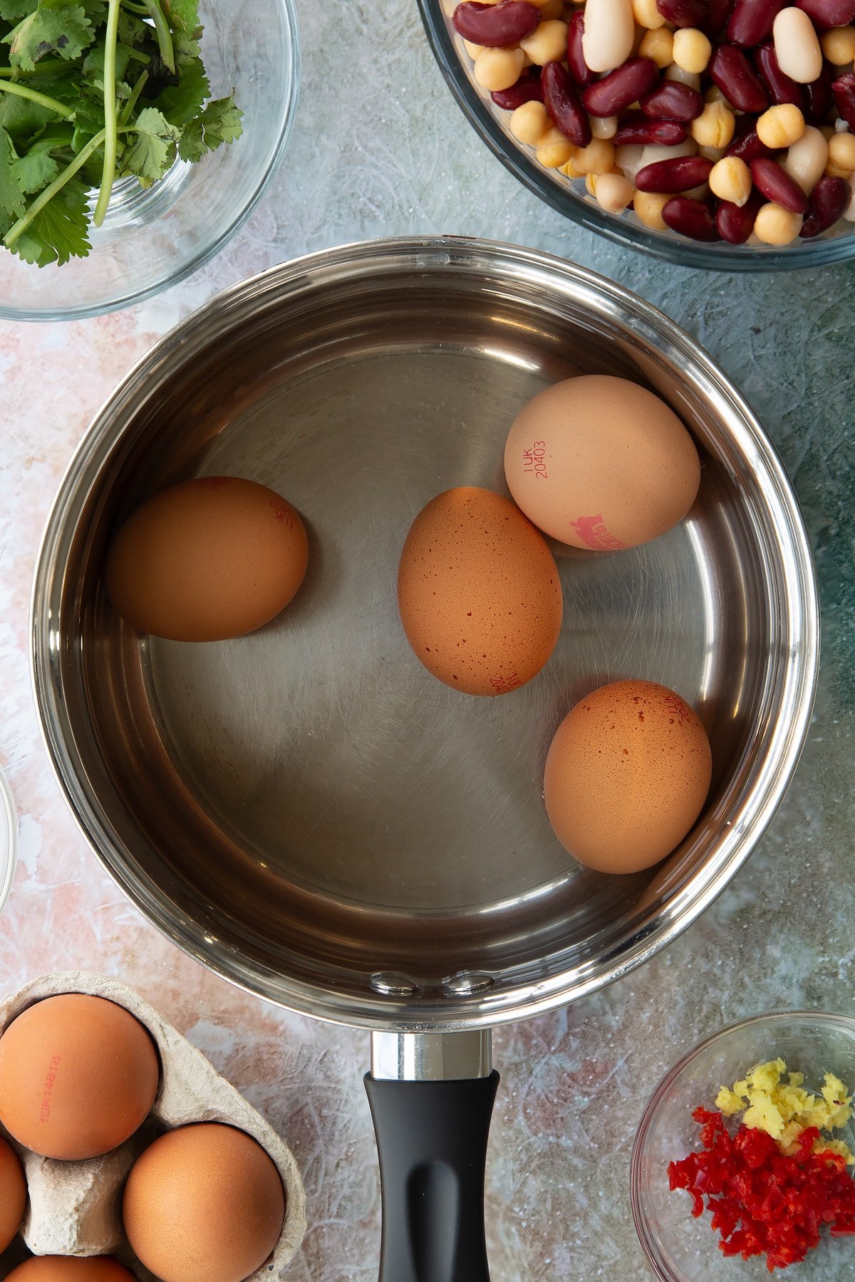 4 eggs in a saucepan.