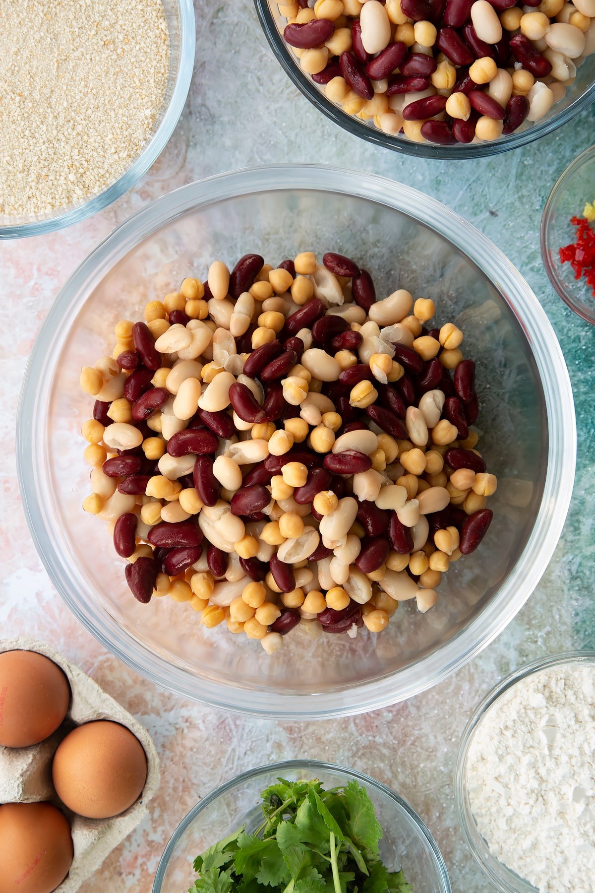 drained canned beans and chickpeas in a clear bowl