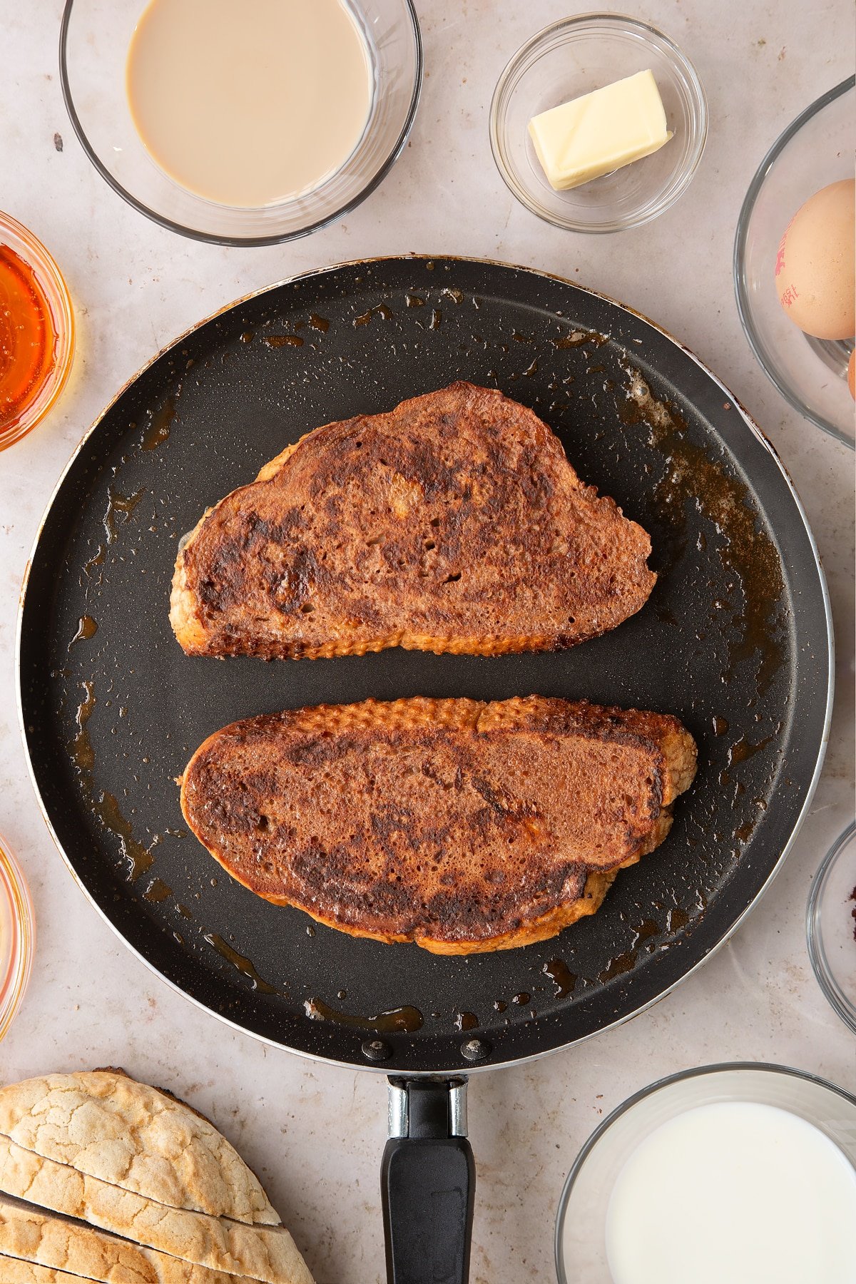 Overhead shot of the toast in a pan once fried.