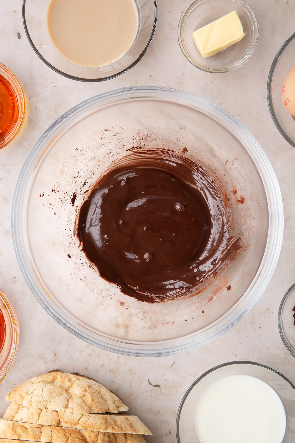 Overhead shot of the cocoa and golden syrup in a mixing bowl having been mixed together. 