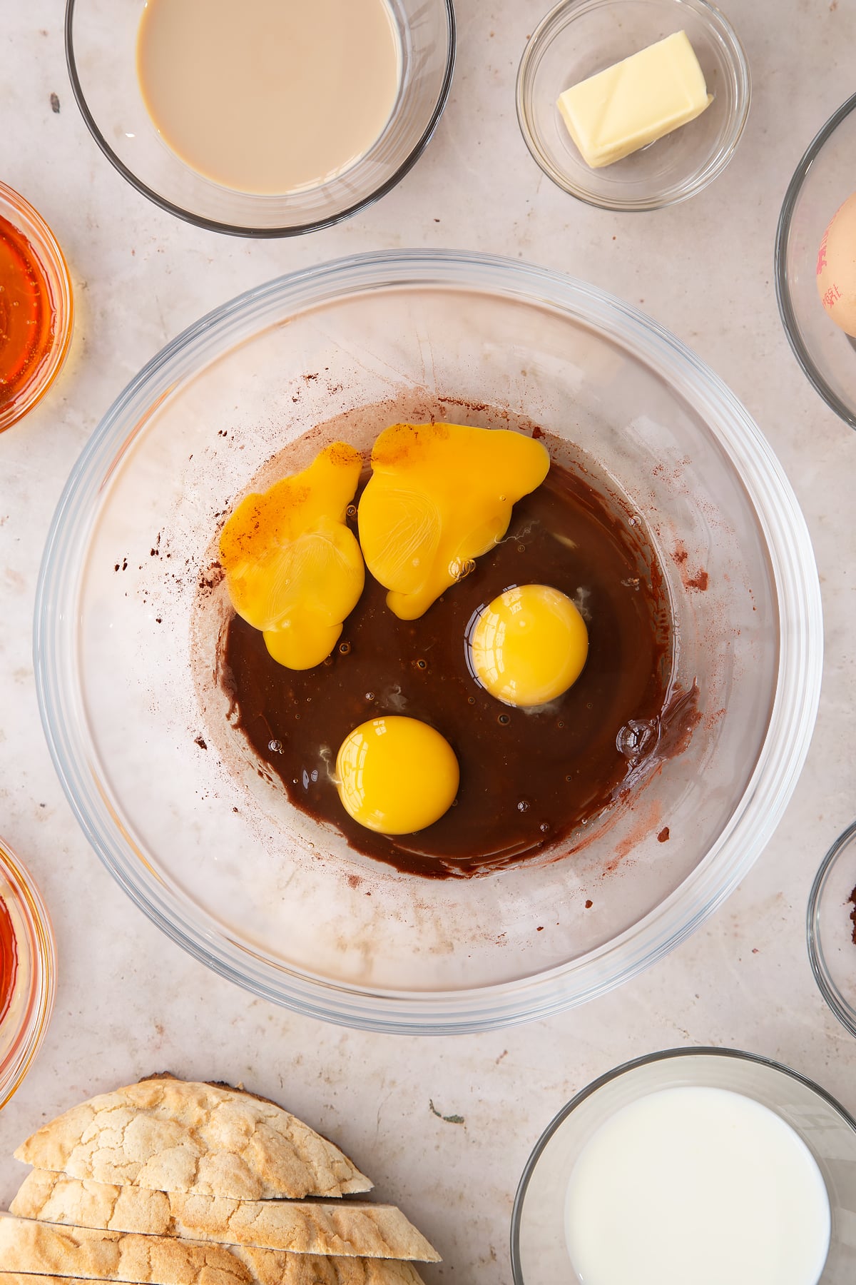 Adding eggs to the Baileys French toast mixture.