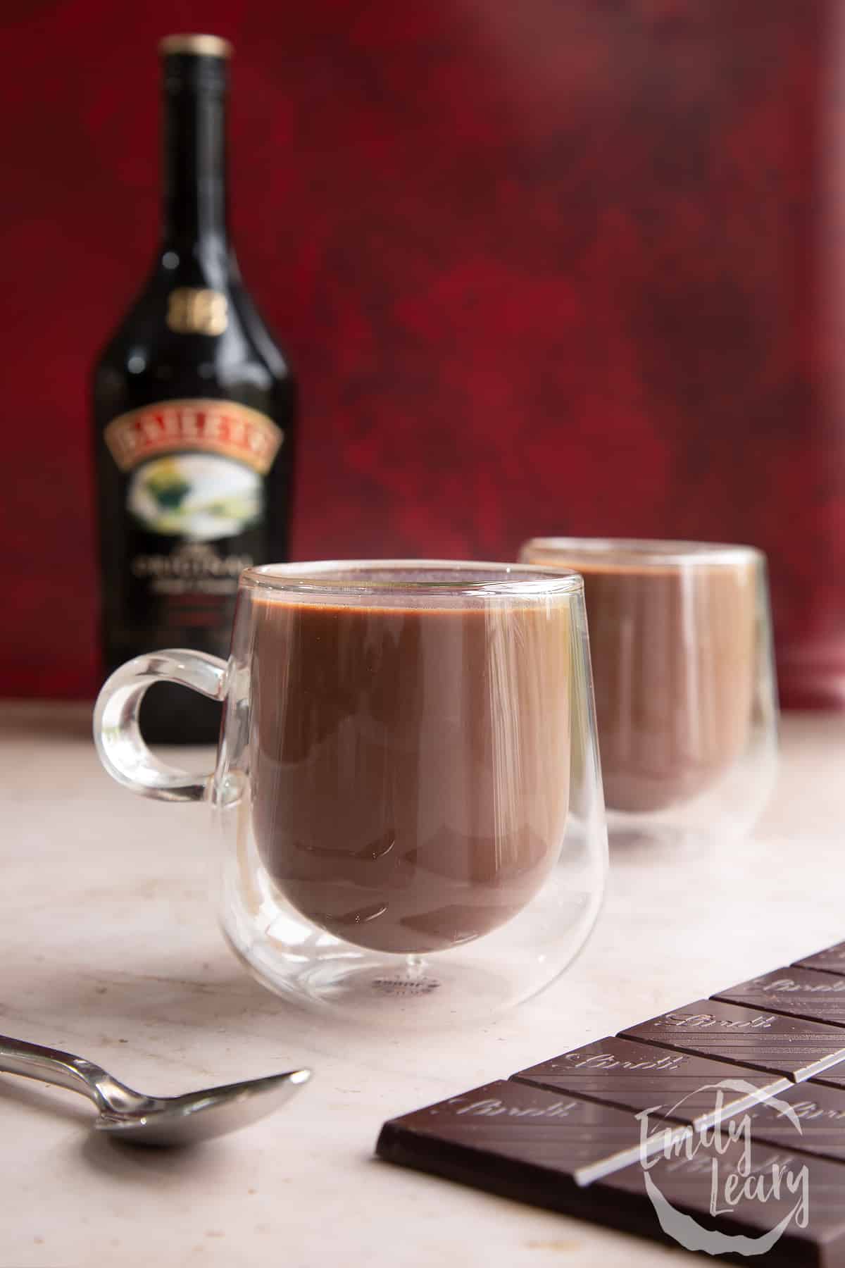 Two mugs of a rich Baileys hot chocolate recipe.
