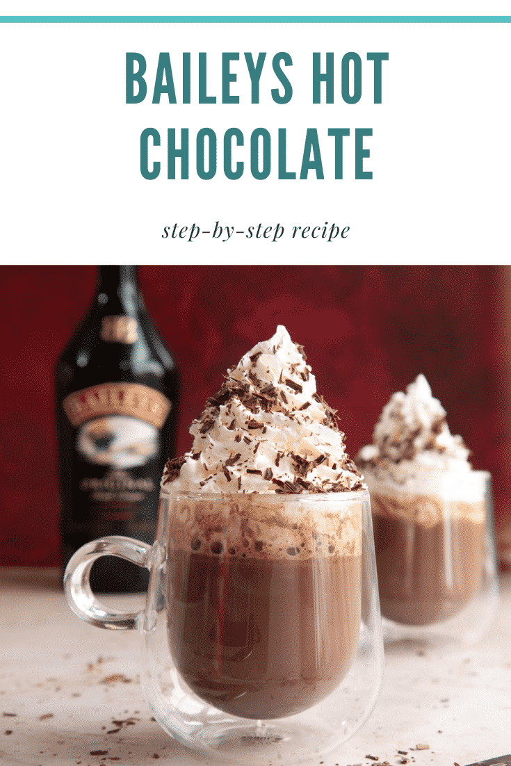 Two mugs of a rich Baileys hot chocolate recipe, topped with whipped cream and chocolate shavings. Caption reads: Baileys hot chocolate. Step-by-step recipe.