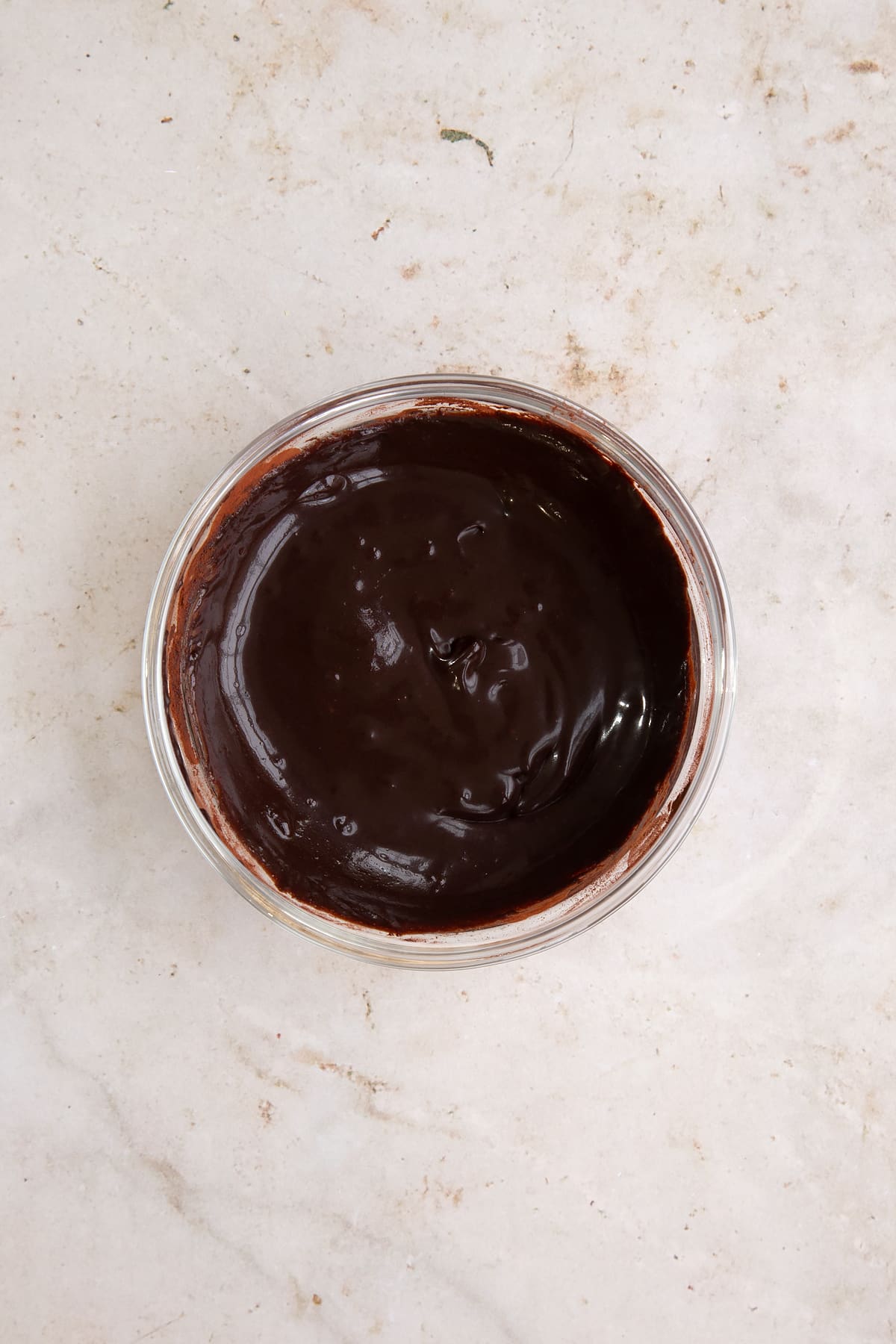 Cocoa, sugar and a little milk, mixed to a paste in a little bowl.