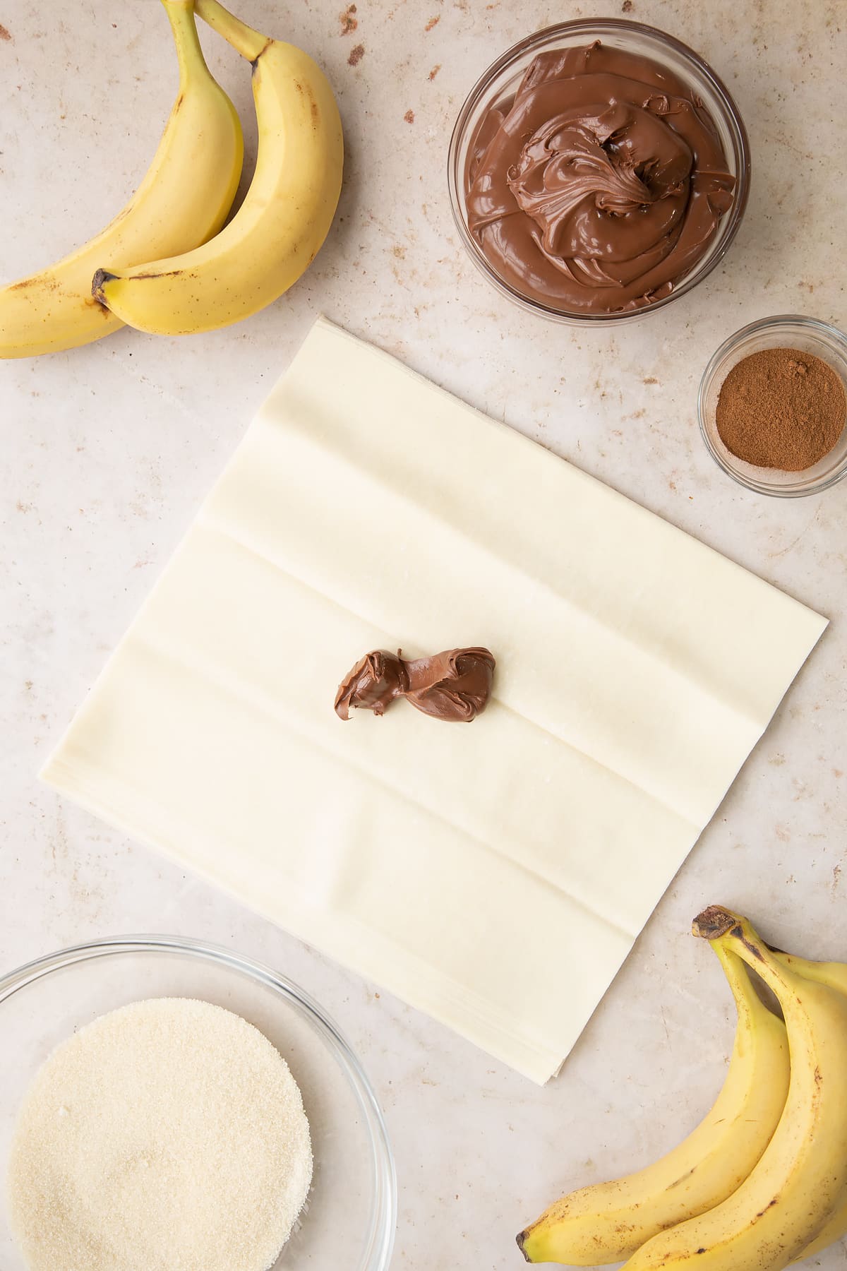 Overhead shot of the filo pastry being filled with the chocolate filling. 