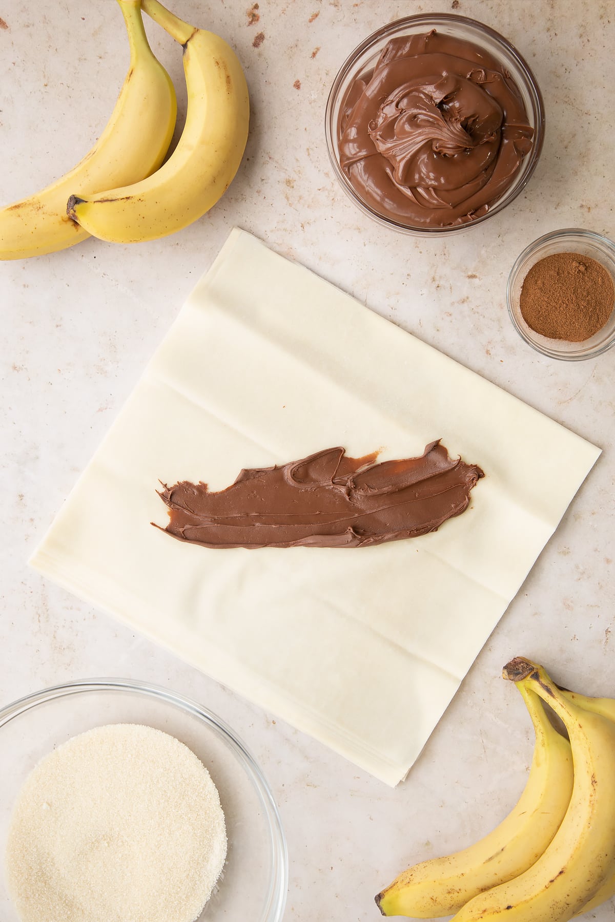 Overhead shot of the chocolate filling being rolled out on the filo pastry.