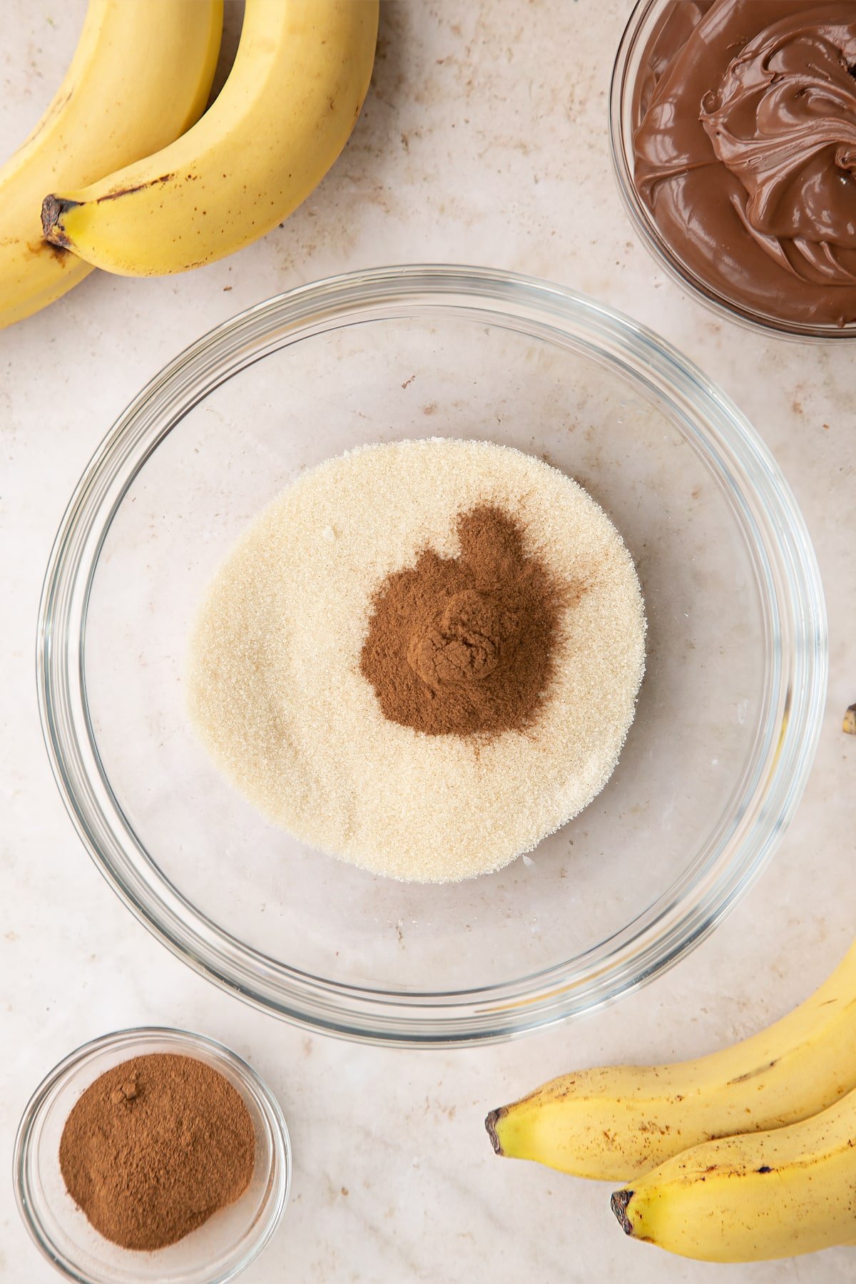 Sugar and cinnamon in a large bowl.