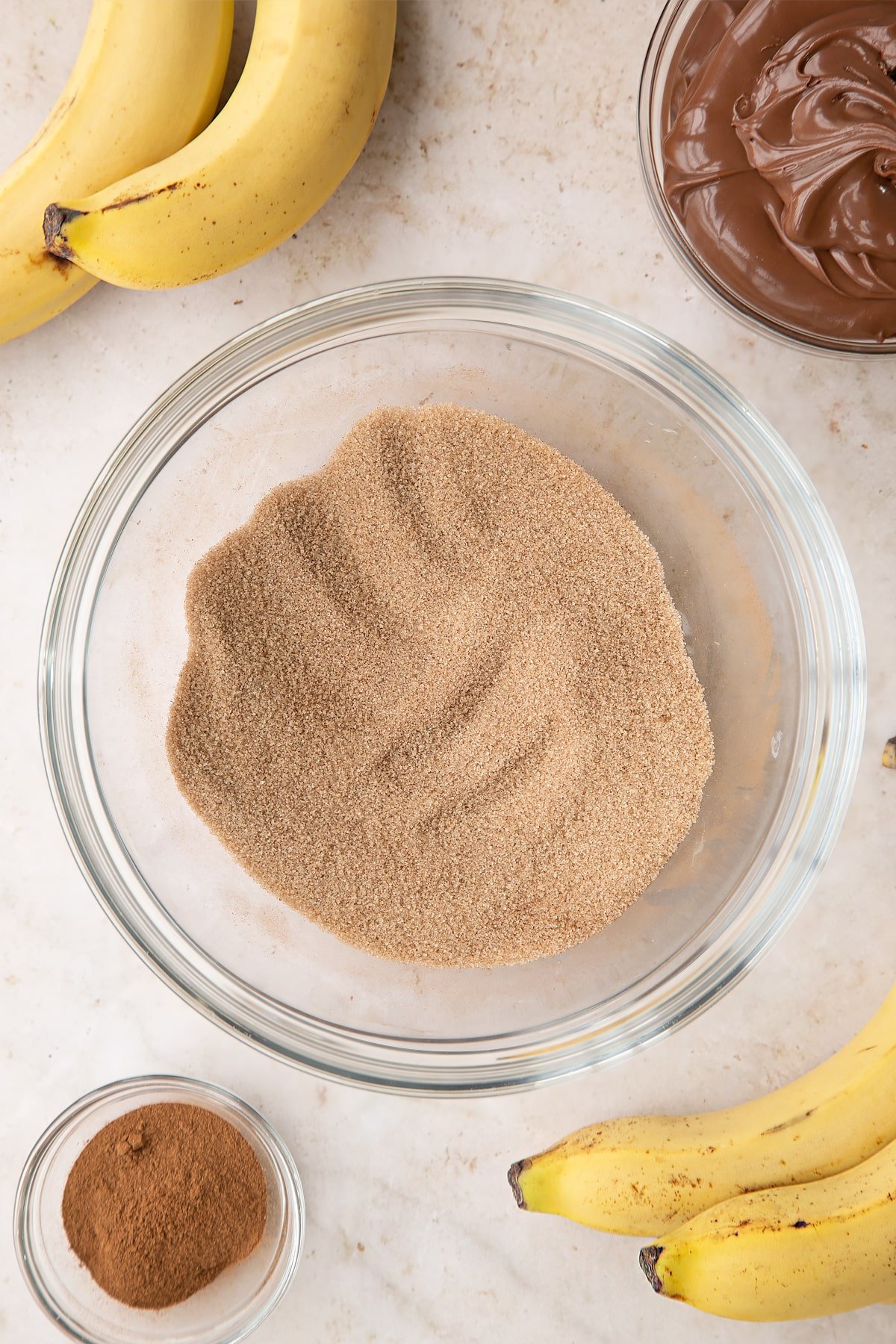 Overhead shot of the sugar and cinnamon mixed together in a bowl.