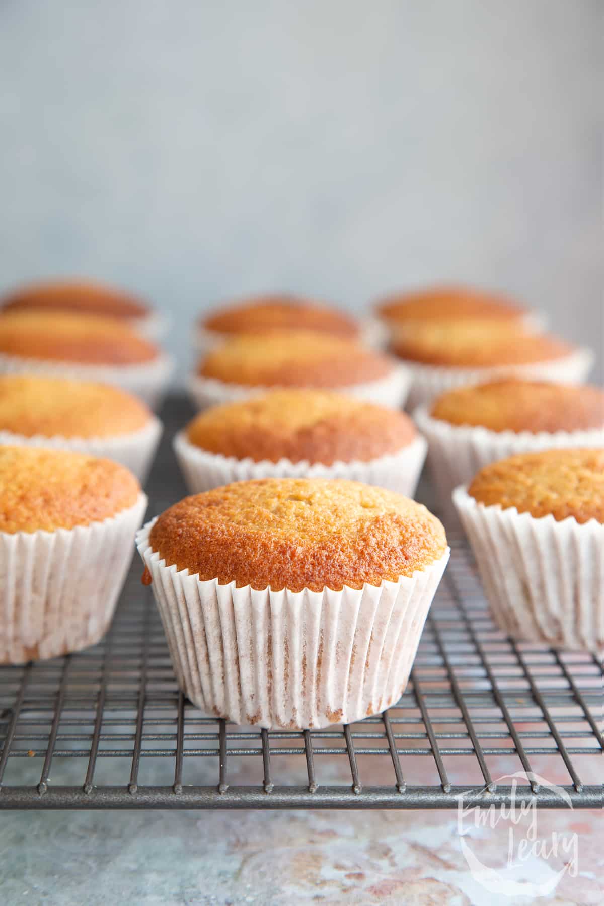 Banana cornmeal muffins on a wire rack.