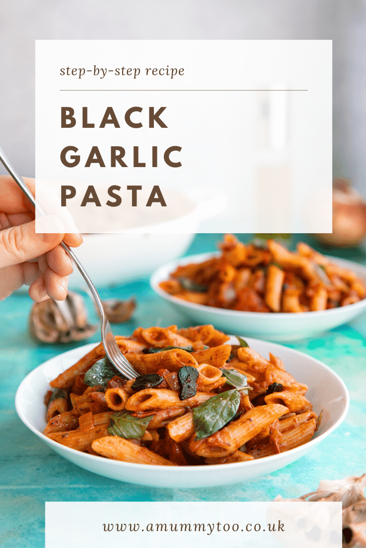 Side on shot of the black garlic pasta with text at the top of the image to describe it for Pinterest.