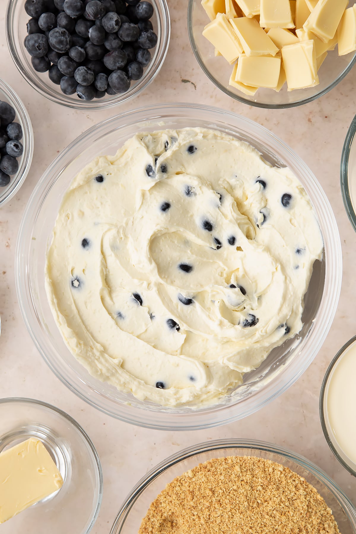 Blueberry cheesecake pie filling in a bowl.