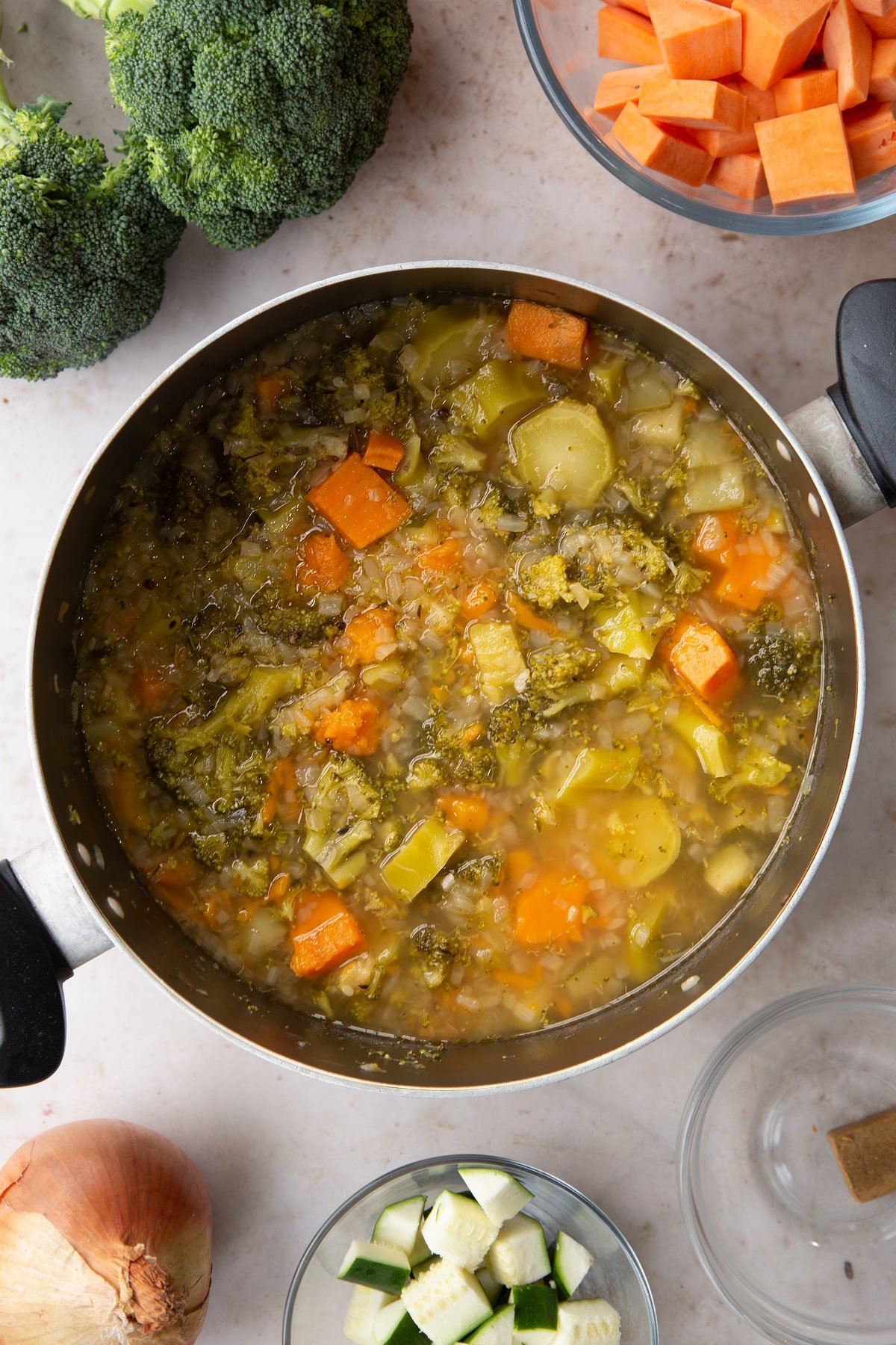 Overhead shot of the broccoli and sweet potato soup ingredients after the pan has been simmering for 20 minutes.