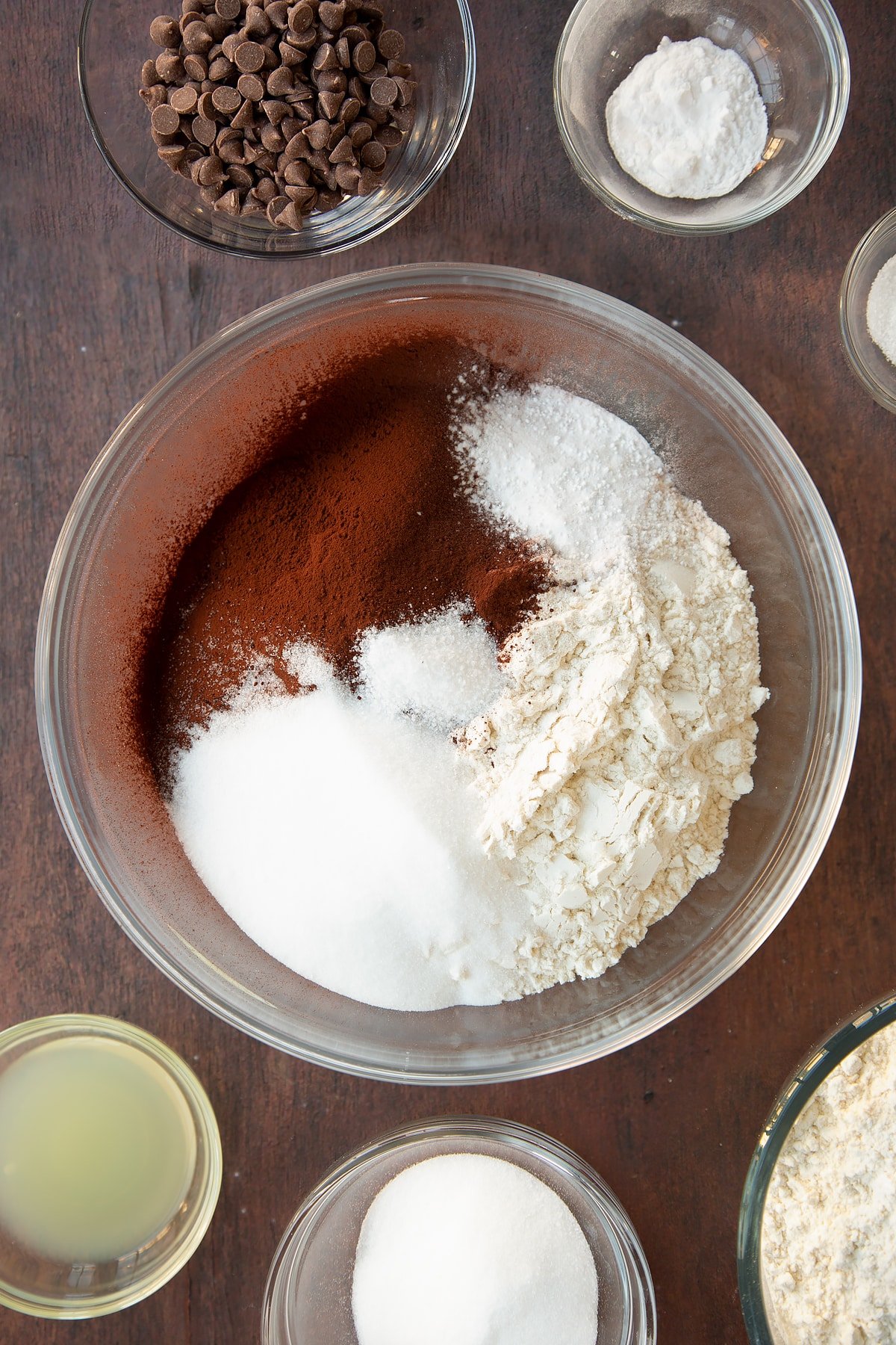 Overhead shot of some of the chocolate soda bread ingredients being added to a bowl.