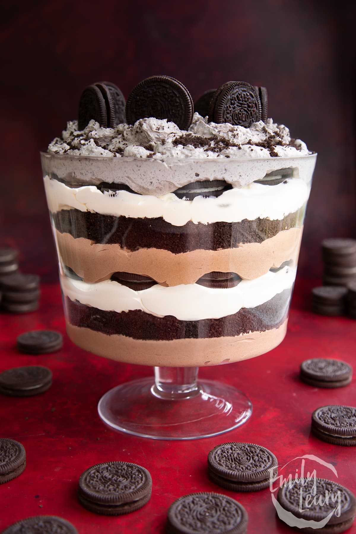Oreo trifle with layers of chocolate pudding, whipped cream and Oreos.