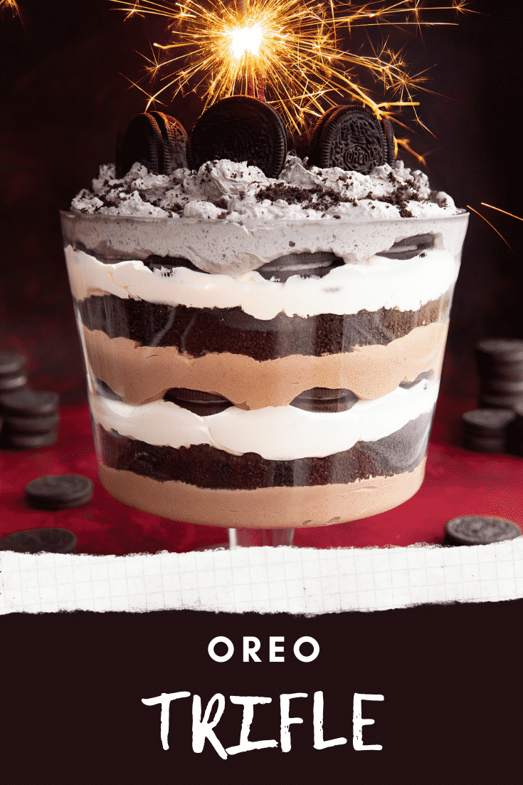 Oreo trifle with layers of chocolate pudding, whipped cream and Oreos. It's decorated with a sparkler. Caption reads: Oreo trifle.