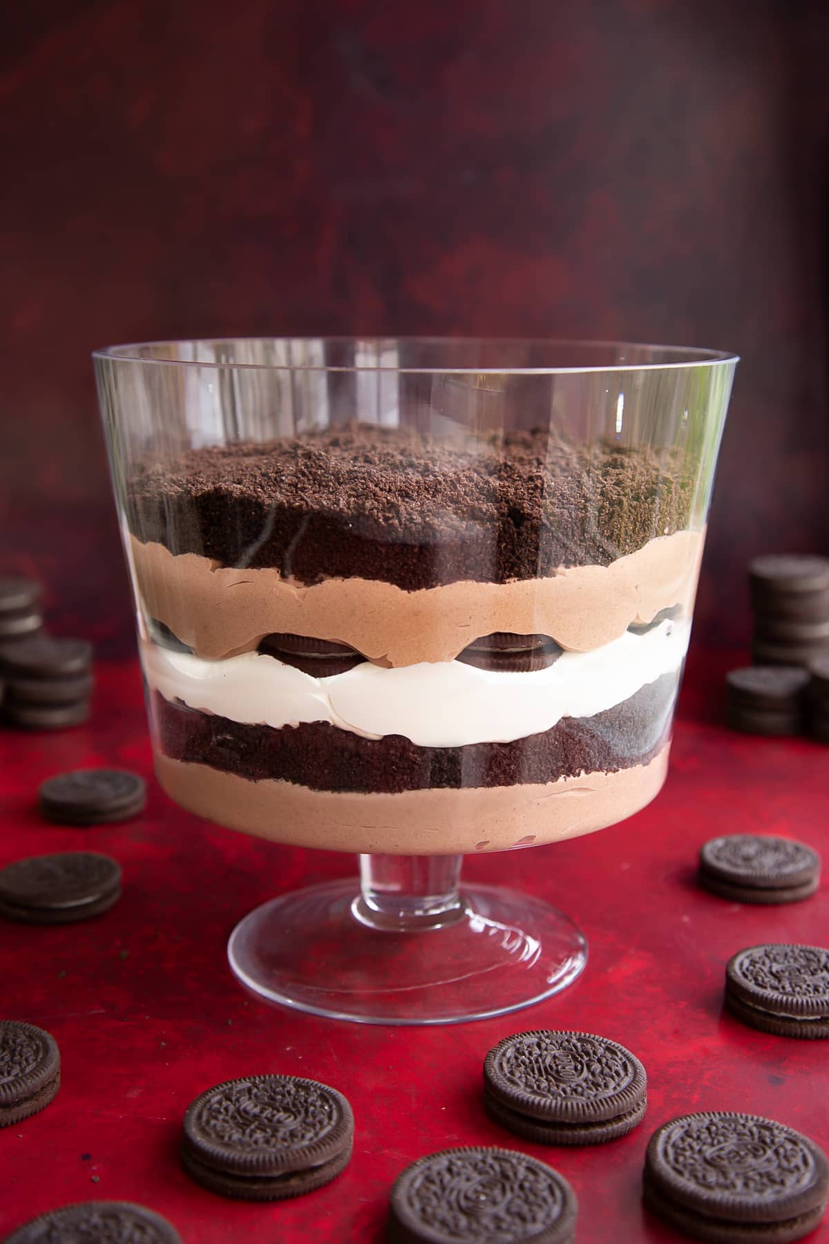 A layer of chocolate pudding, then crushed Oreos, then whipped cream, then Oreos, then chocolate pudding, then crushed Oreos in a trifle bowl.