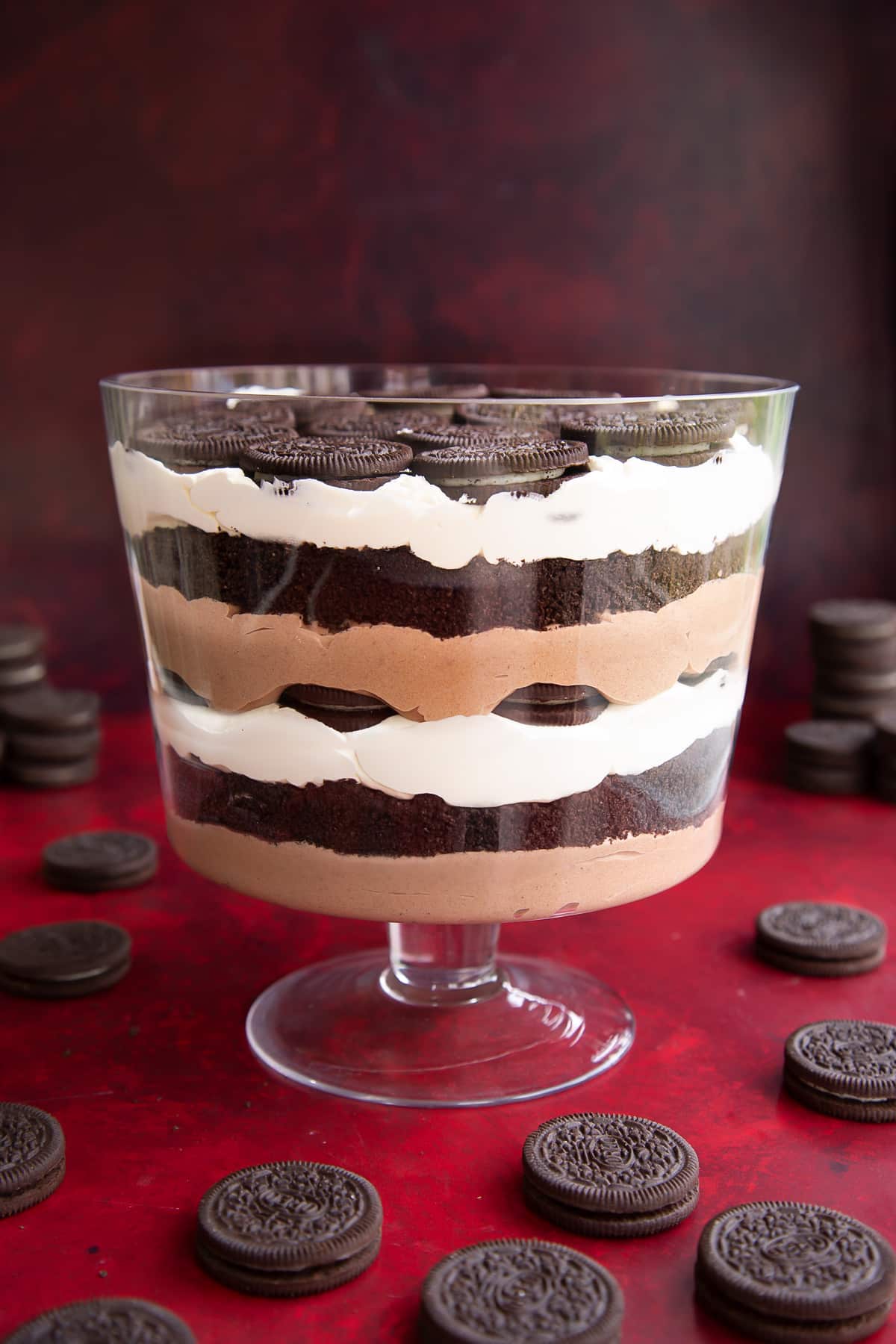A layer of chocolate pudding, then crushed Oreos, then whipped cream, then Oreos, then chocolate pudding, then crushed Oreos, then cream, then Oreos in a trifle bowl.