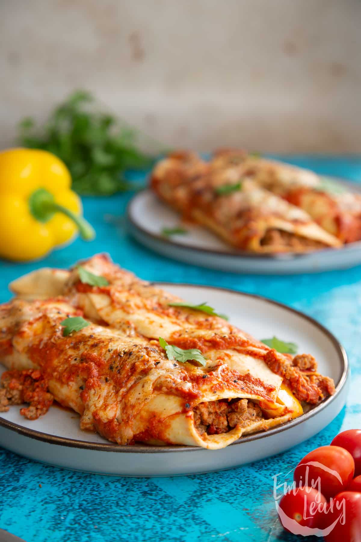 Quorn mince enchiladas served on a grey plate.
