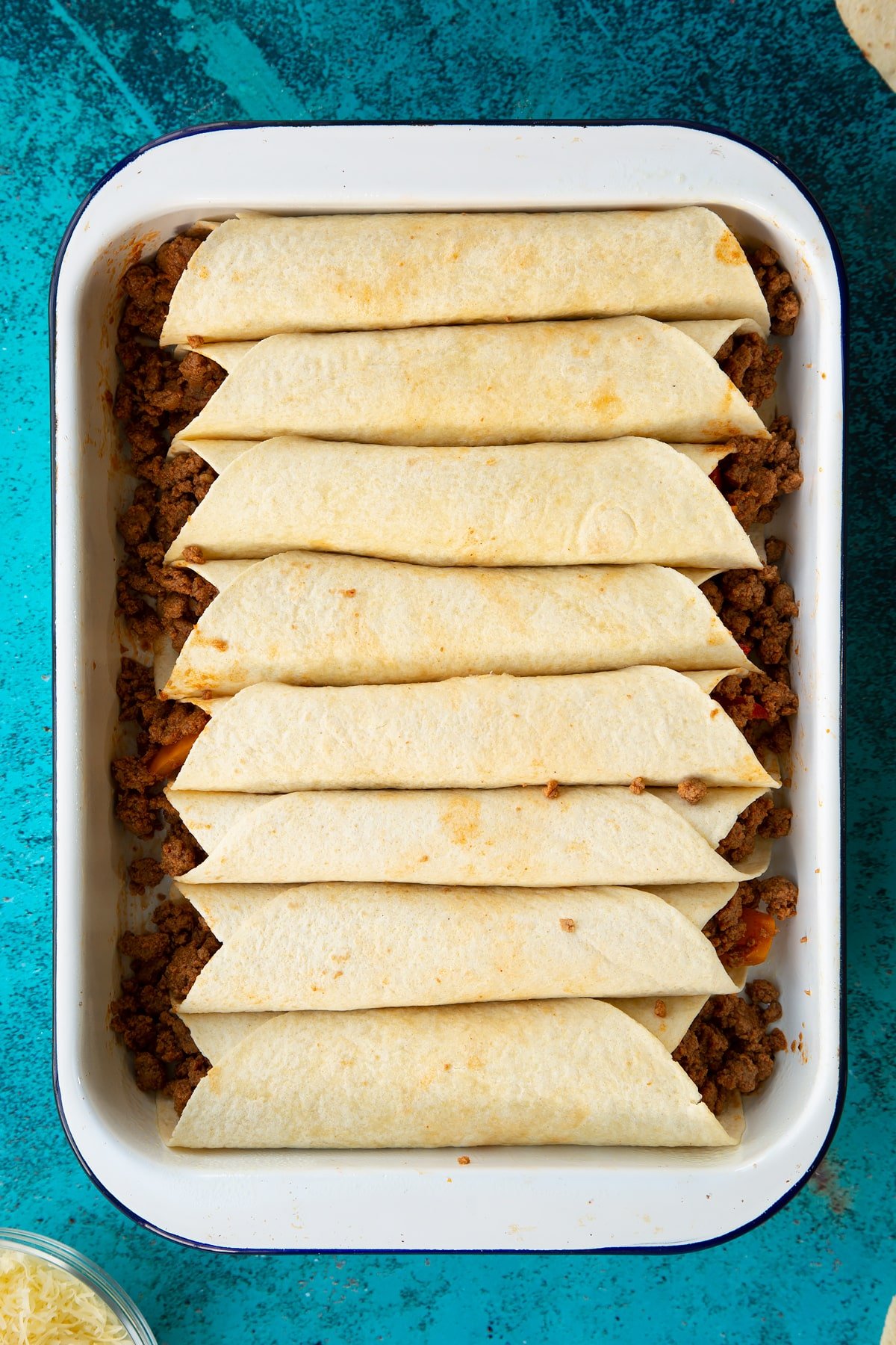 A tray of tortillas filled with Quorn mince enchilada filling.