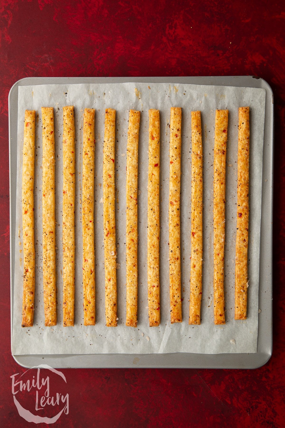 Overhead shot of the spicy cheese straws having been in the oven for 10 minutes.