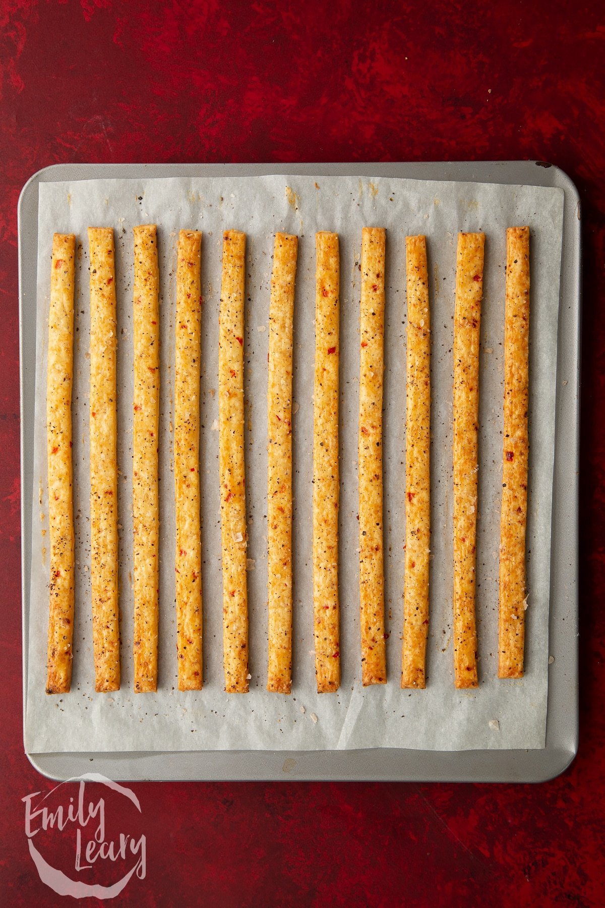 Overhead shot of the spicy cheese straws having been in the oven for 10 minutes.