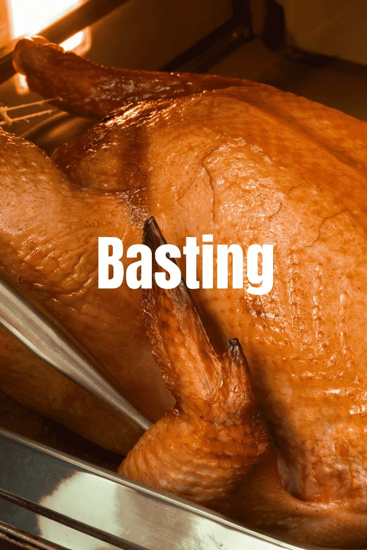 Close up shot of a finished roasted turkey with text on top that says 'basting'