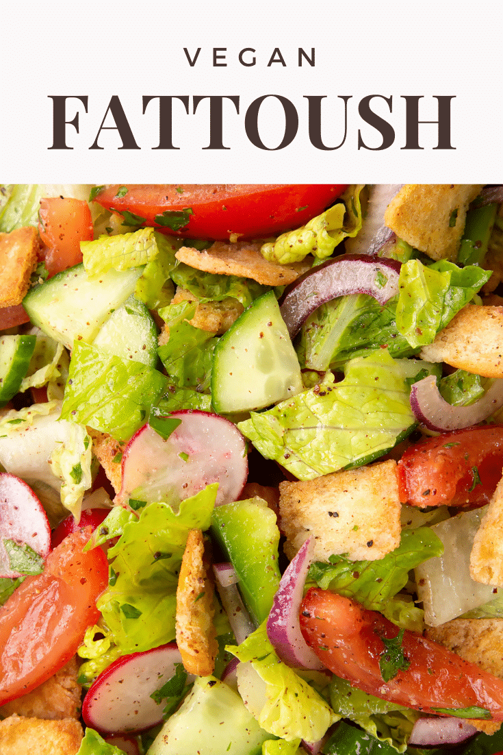 Close up of vegan fattoush showing the vegetables, lettuce, pitta croutons and dressing. Caption reads: Vegan fattoush.