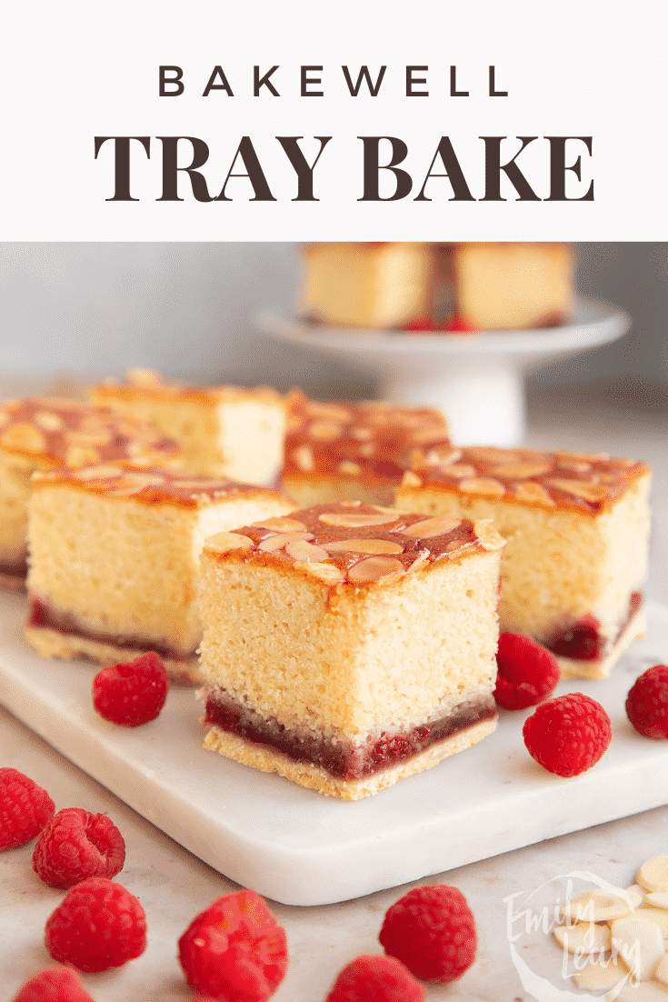 Squares of Bakewell tray bake on a white marble board. Caption reads: Bakewell tray bake.