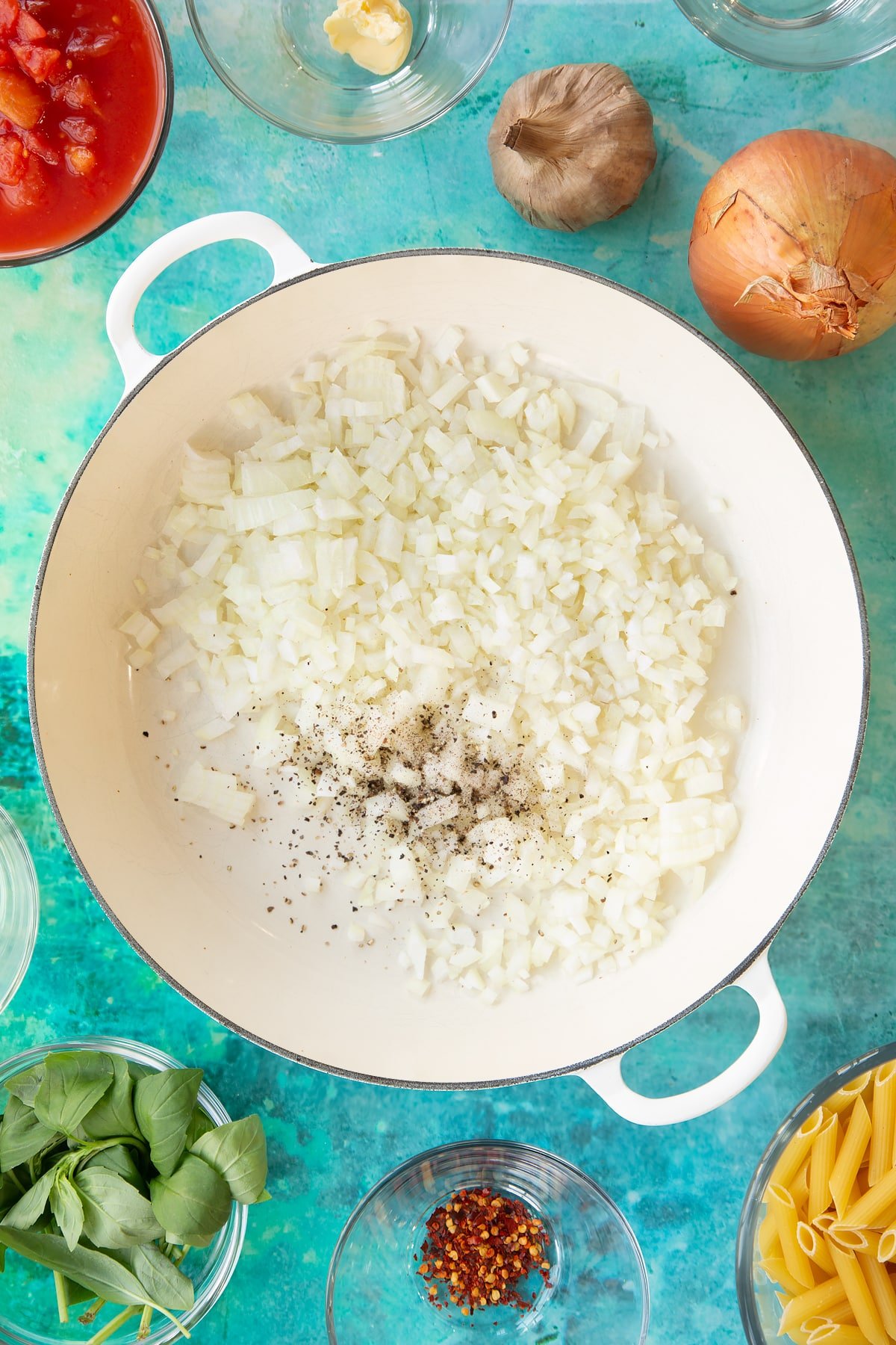 Overhead shot of diced onions in a pan.