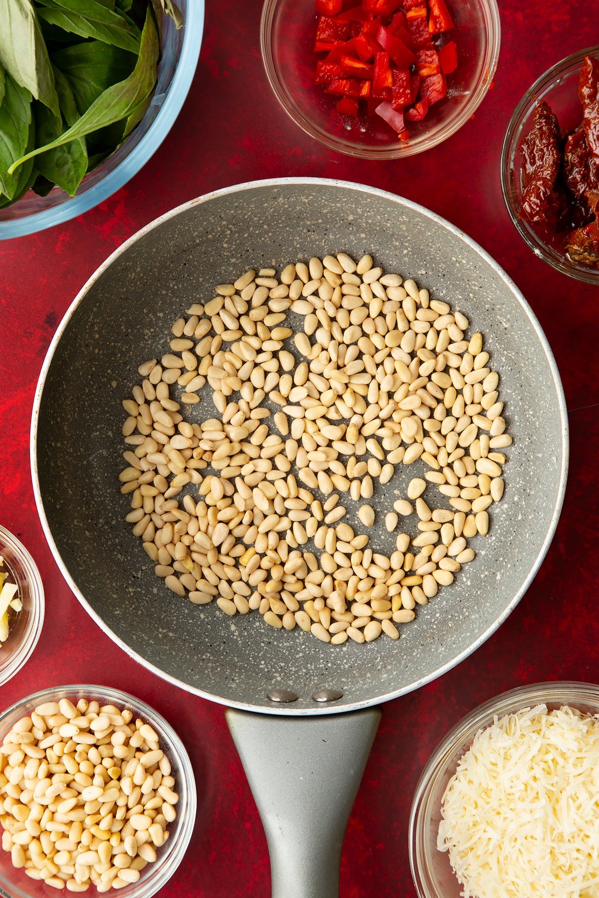 Overhead shot of the pine nuts in a pan.