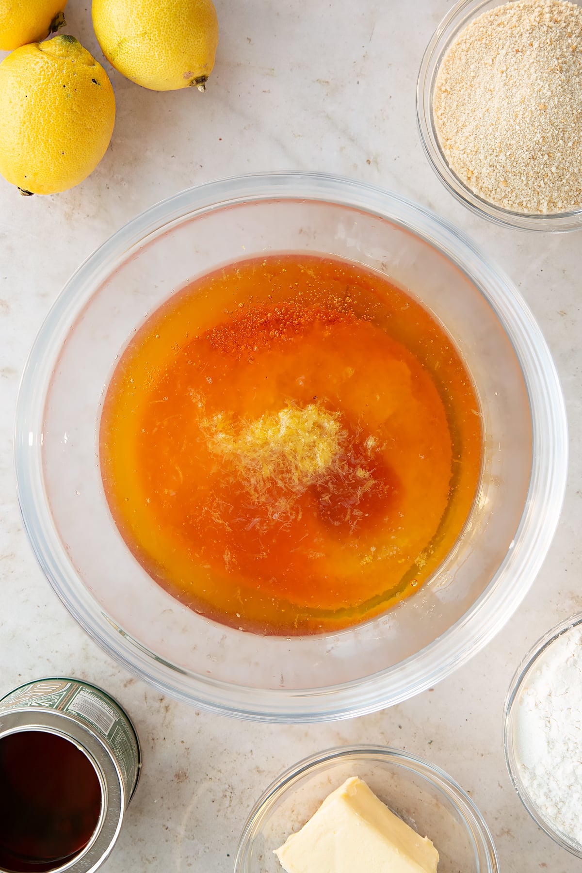 Overhead shot of ingredients for the lemon treacle tart mixed together in a mixing bowl.