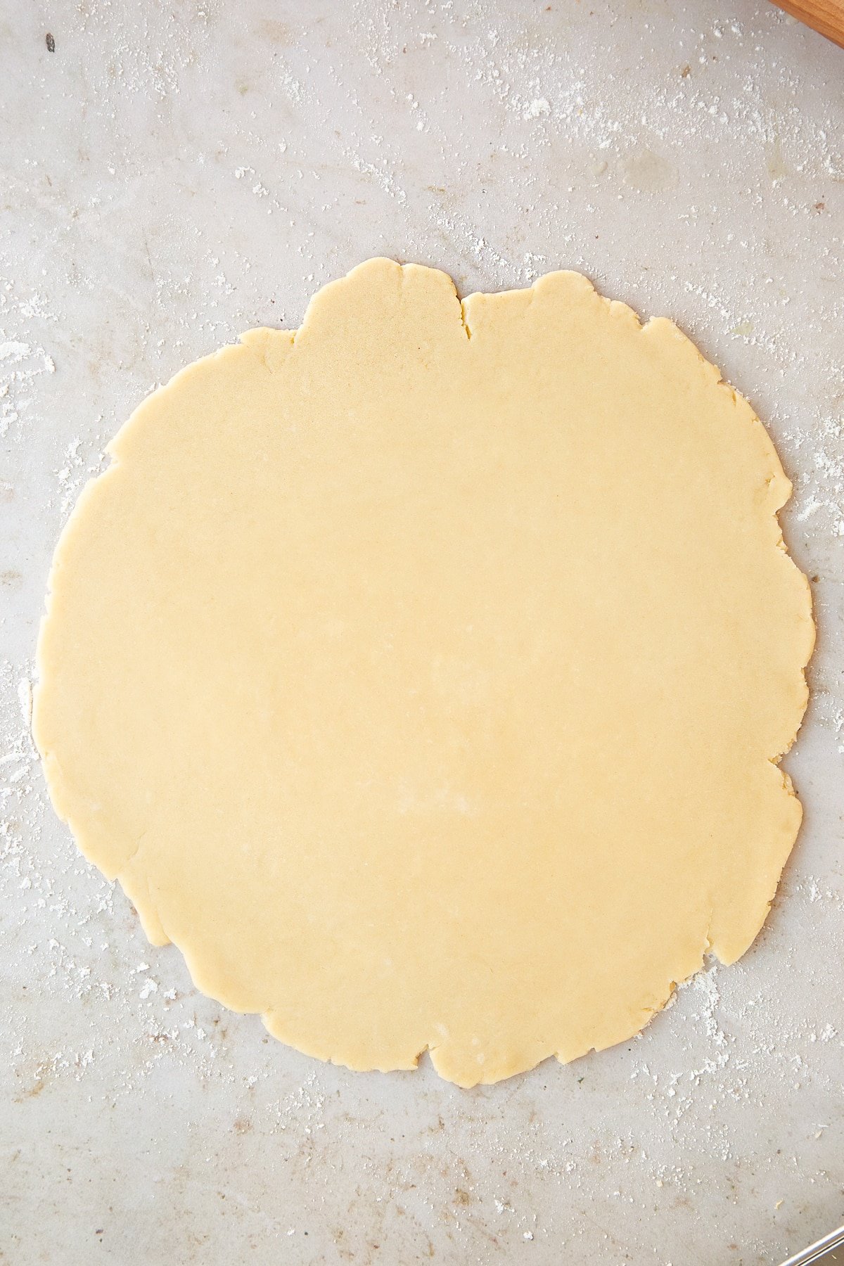 Overhead shot of the dough being rolled out. 