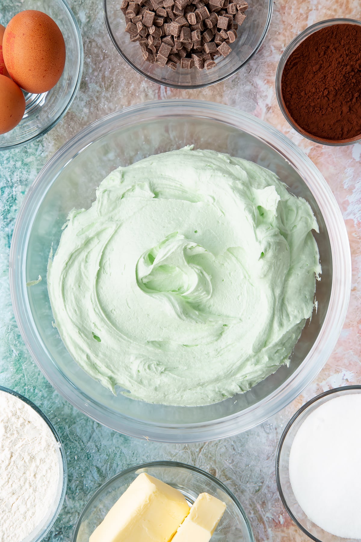 Overhead shot of the mint choc chip cupcakes frosting after adding the food colouring.