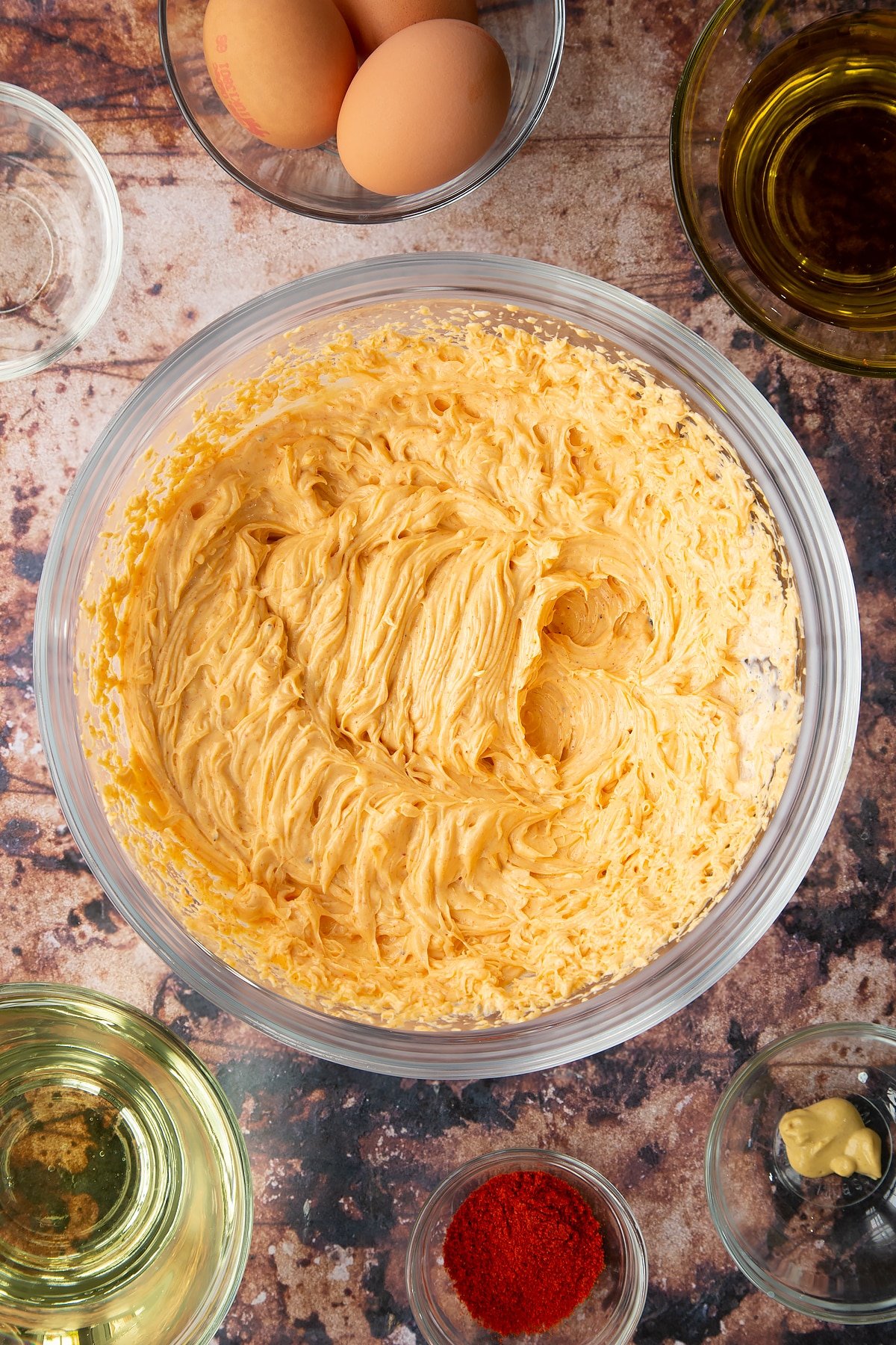 Paprika mayo in a glass mixing bowl. 