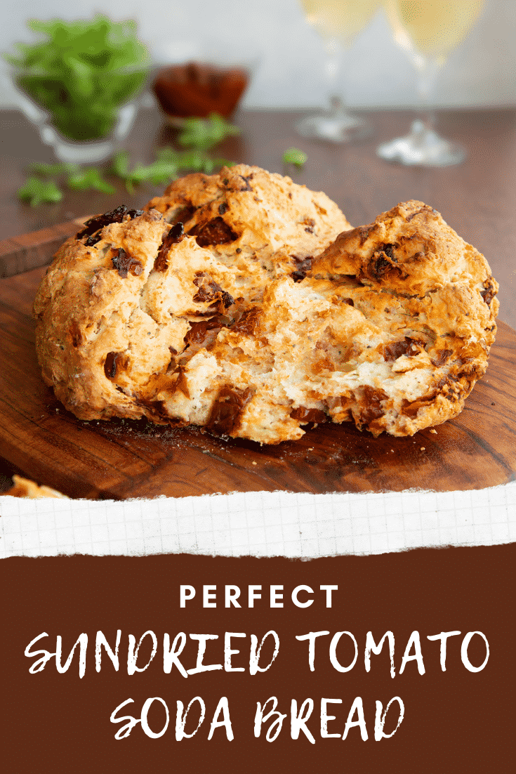 Sundried tomato soda bread on a board. It has been broken open. Caption reads: Perfect Sundried tomato soda bread