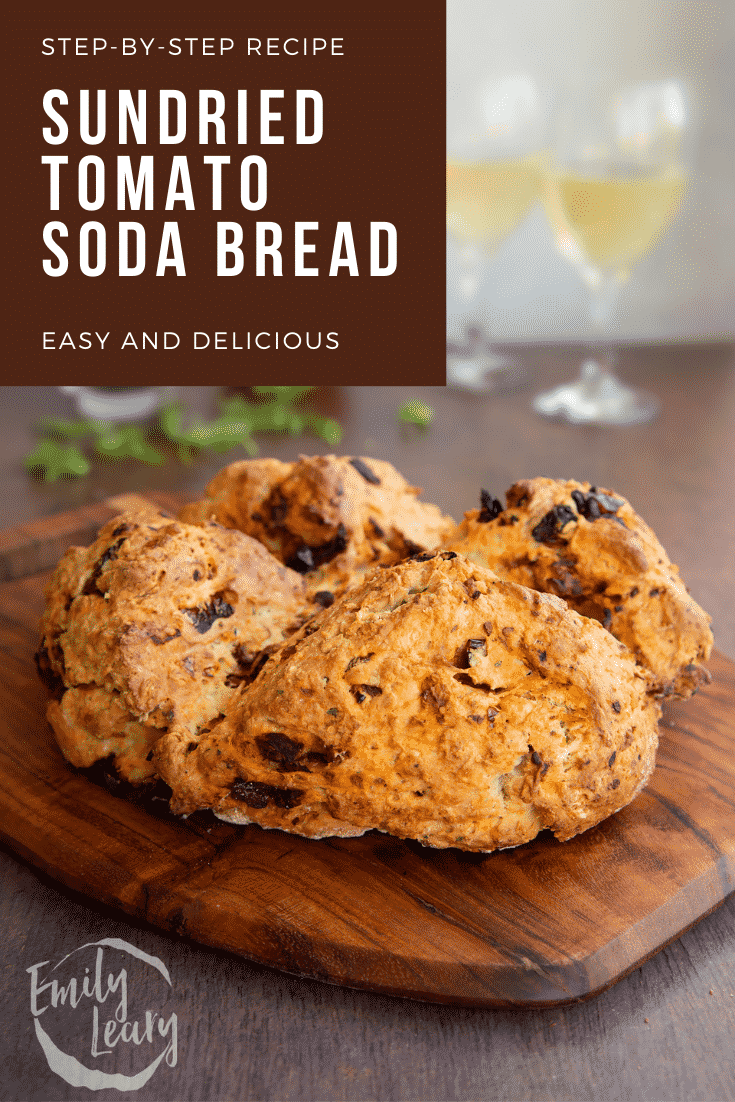 Sundried tomato soda bread on a board. It has been broken open. Caption reads: Step-by-step recipe Sundried tomato soda bread. Easy and delicious.