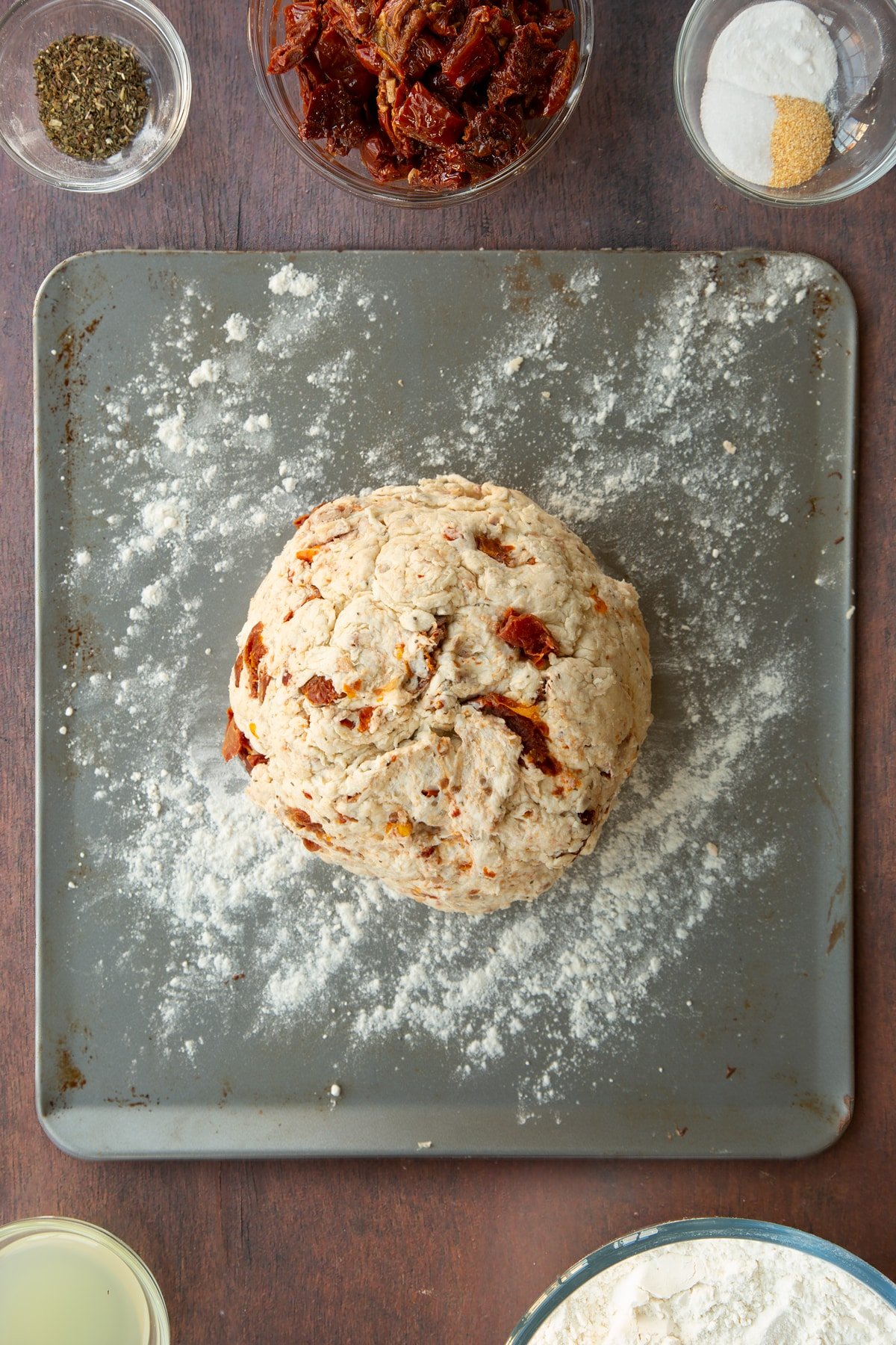 Sundried tomato soda bread dough in a baking tray.