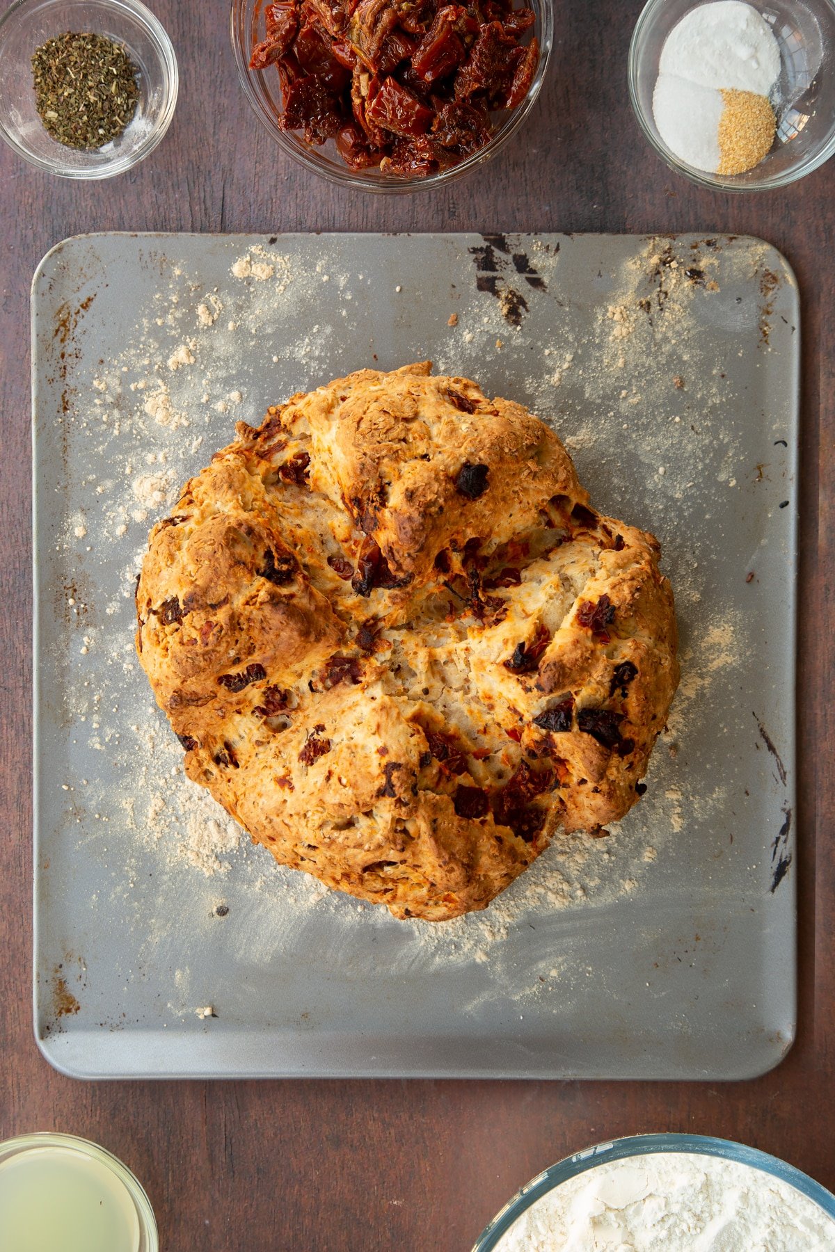 Freshly baked Sundried tomato soda bread on a silver baking tray