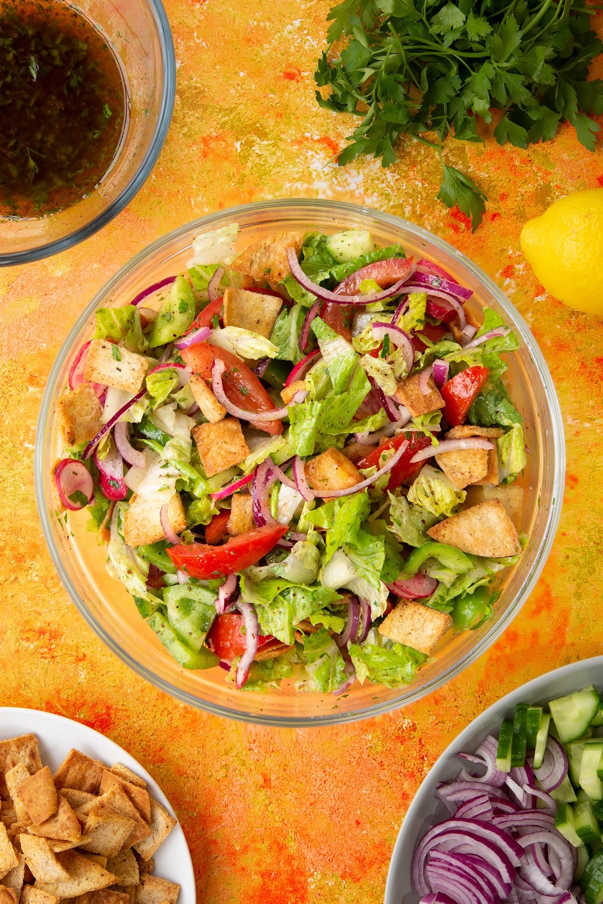 Vegan fattoush in a glass bowl.