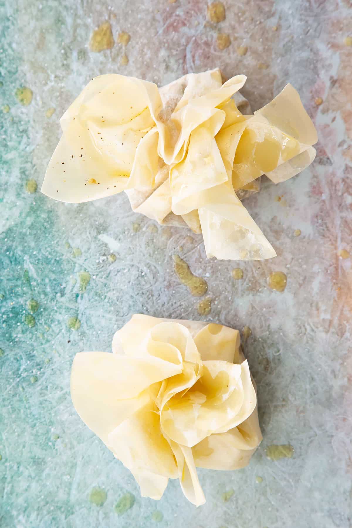 Ruffled filo pastry drizzled with oil.