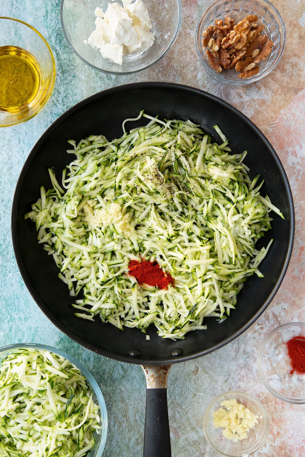 grated courgette, garlic, paprika in a large frying pan.