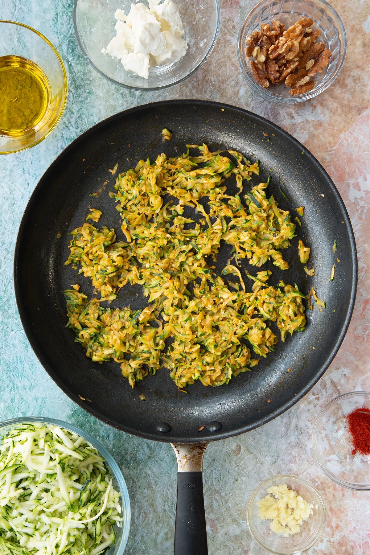 cooked grated courgette, garlic, paprika in a large frying pan.