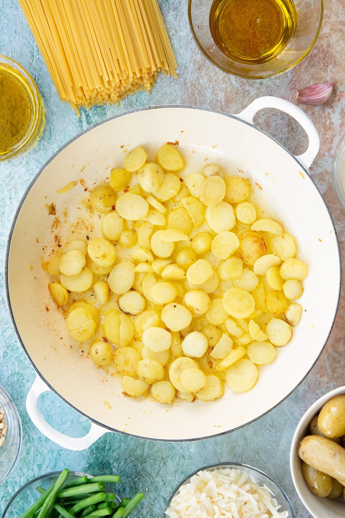 Overhead shot of the sliced potatoes having been fried in a pan.